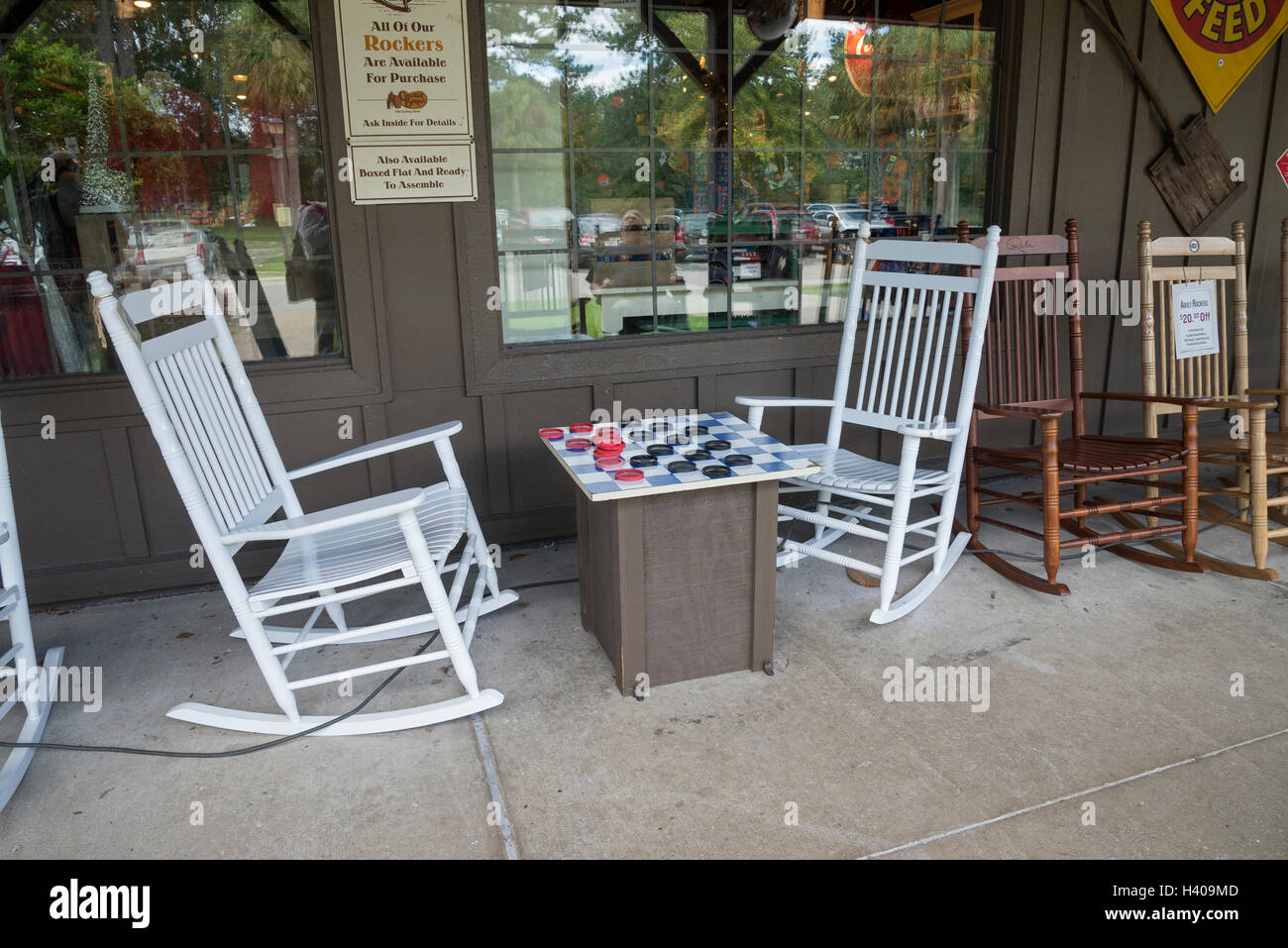 Giant checker set with rocking chairs in front of a Cracker Barrel restaurant. Stock Photo