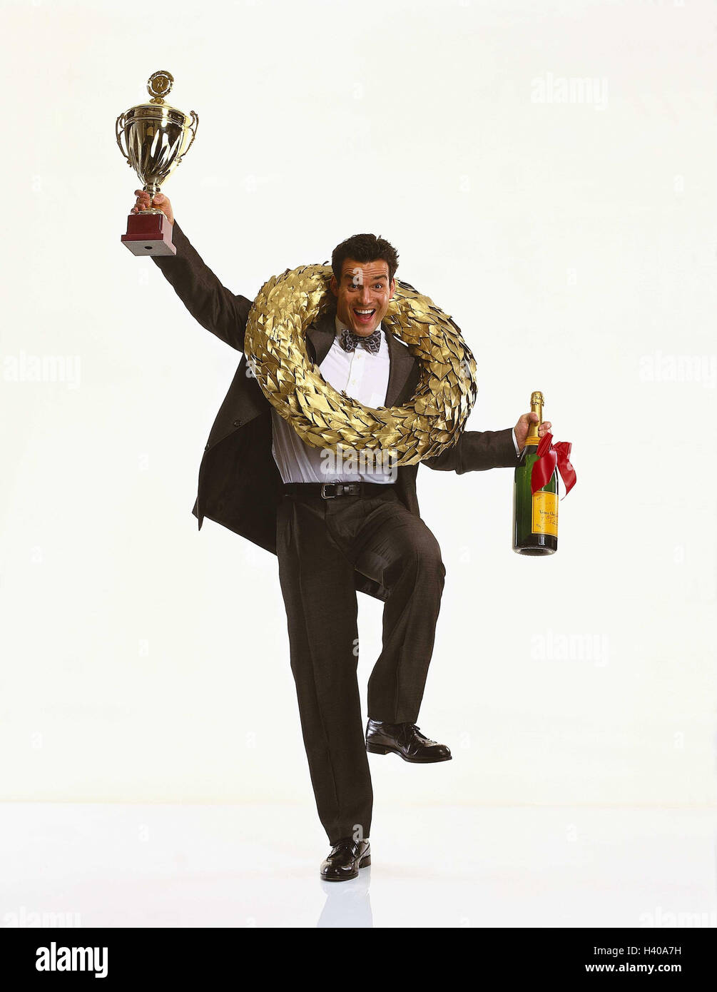 Businessman, young, winner's rim, cup, champagnes, gesture, cheering, success Men, winner, first, best, victory, man, manager, suit, laugh, joy, rejoice, happy, winners, melted, victory trophy, Bottle, hold up, studio, cut out Stock Photo