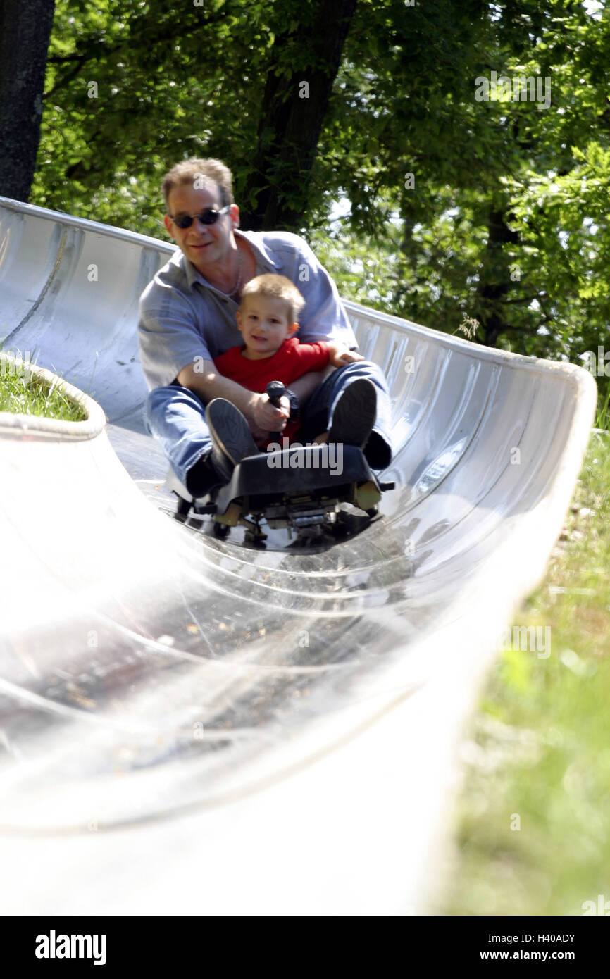 Summer toboggan run, father, son, toboggan, drive together, happily no