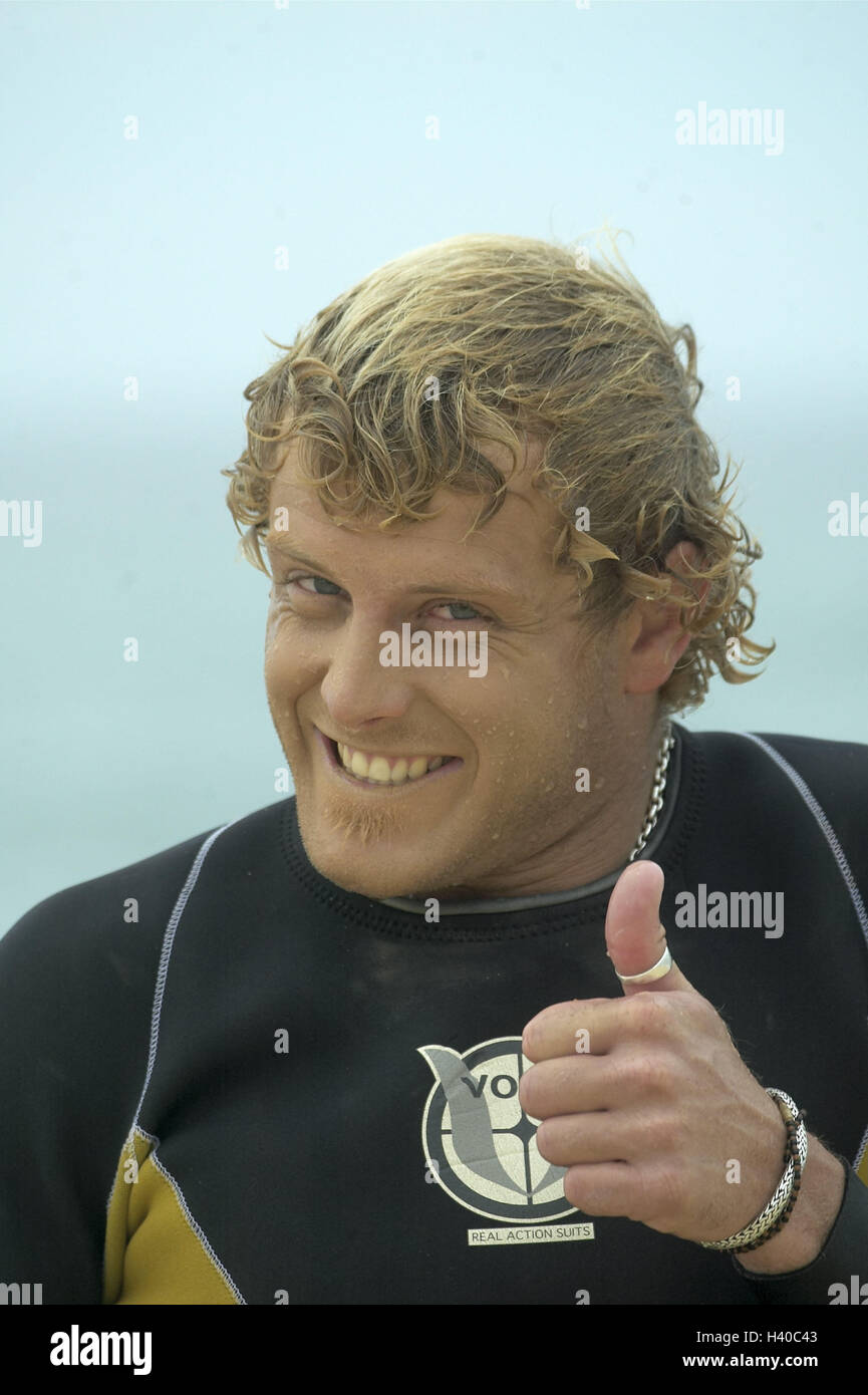 Surfer, happy, gesture, OK, portrait, Europe, France, the South France, close Biarritz, man, young, 20 years, Australians, blond, hairs wet, sportsman, surfing sport, look, joy, cheeky, happy, fun, expression, transmission, positively, pollex high, everyt Stock Photo