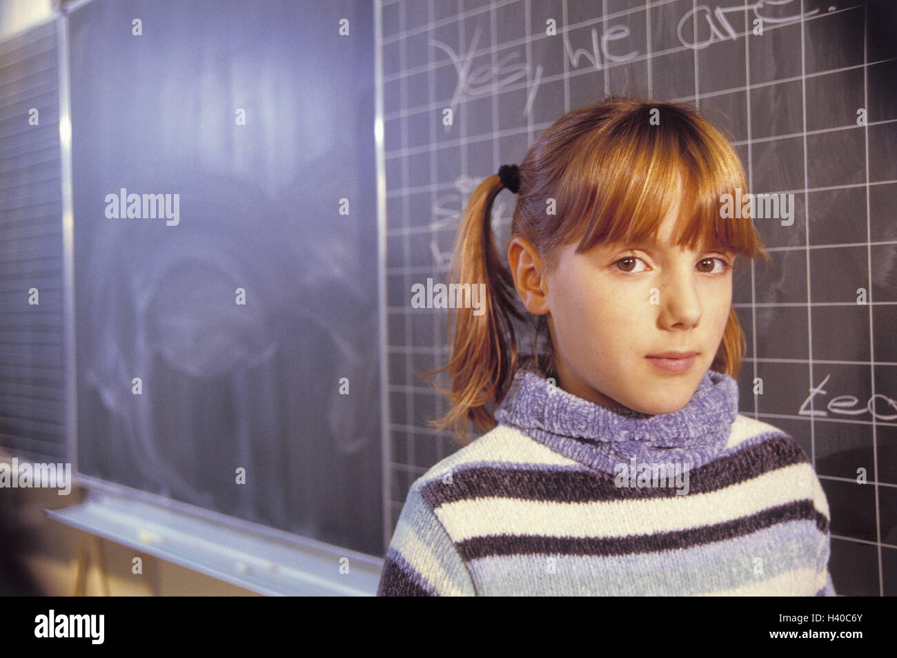 Classrooms, blackboard, girl, English words, portrait, school, classroom, notice board, lessons, school lessons, English lesson, English, foreign language, Zweitsprache, learn, concentration, practise, words, words, practise assignment, child, school chil Stock Photo