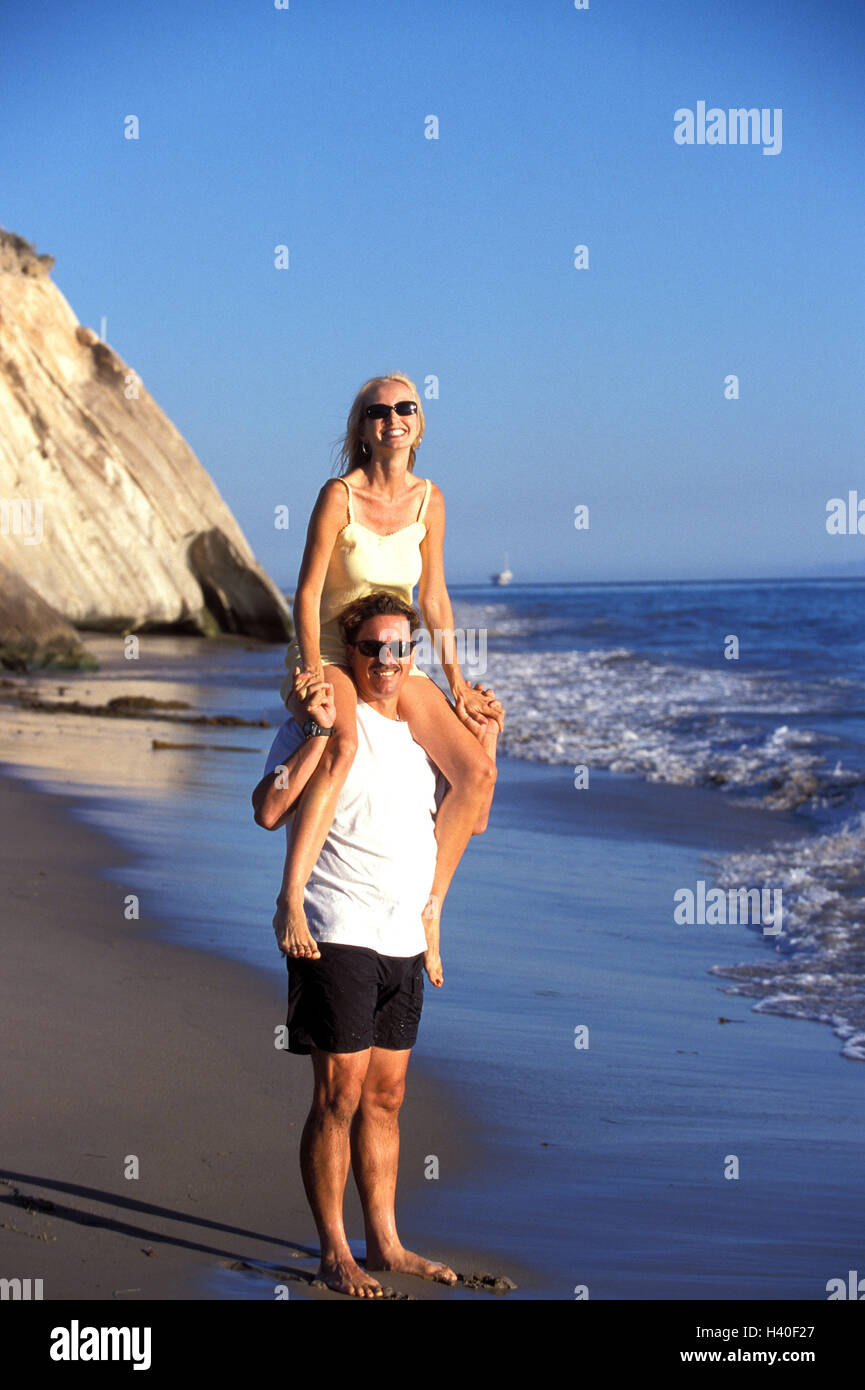 Sandy beach, man, woman, shoulders, carry, happy, 30-40 years, tourists,  couple, together, fun, happy, amusements, cheerfulness, togetherness,  happy, melted, joy, beach walk, rest, recreation, activity, enjoy, beach,  leisure time, vacation, summer vacatio