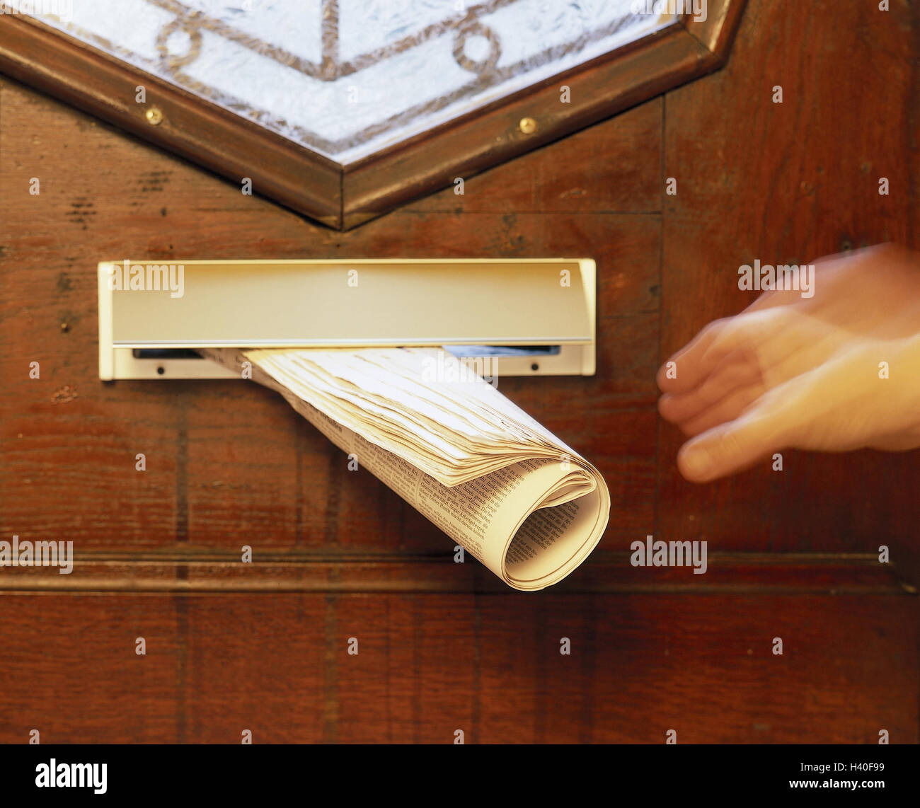 Front door, letter slot, newspaper, person, detail, hand, take, blur