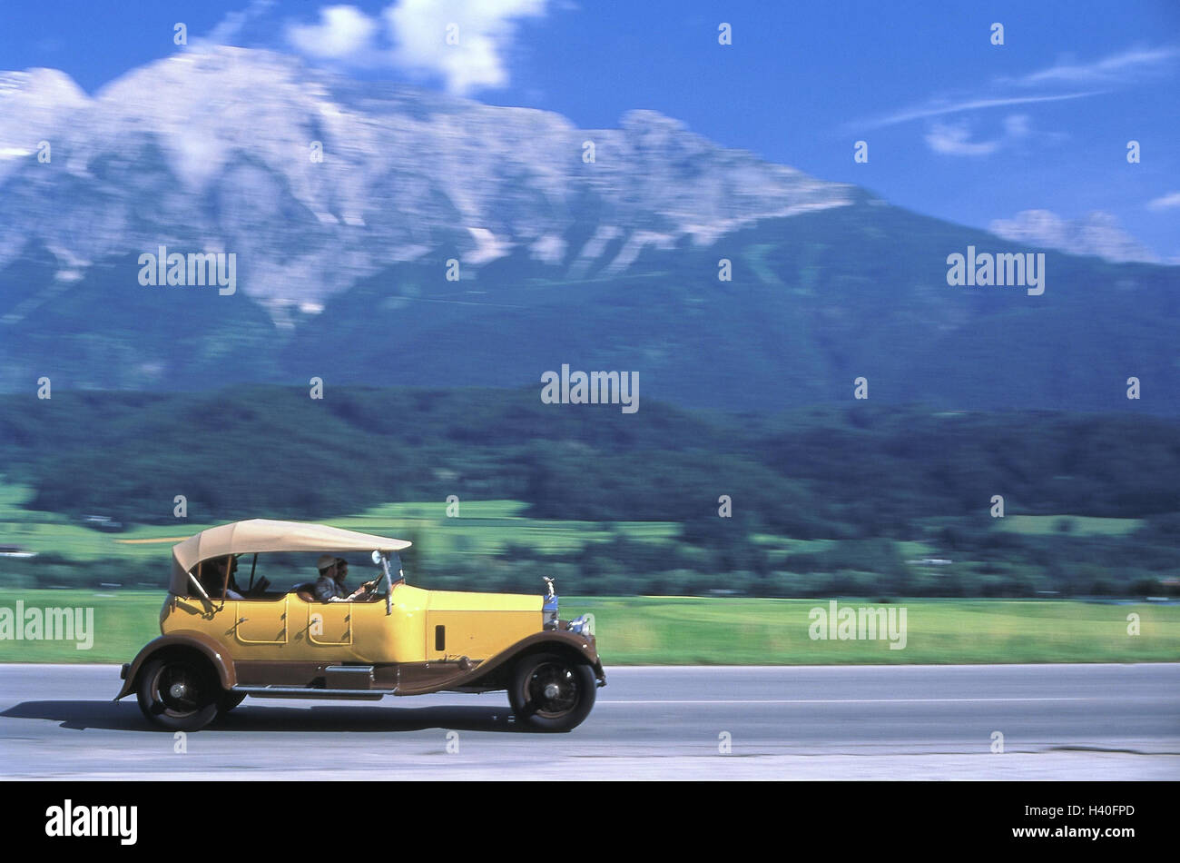 Summer, country road, car, old-timer, Rolls Royce, manikin I, convertible, year construction in 1929!!! ONLY EDITORIALLY!!! Mountain landscape, street, traffic, traffic, passenger car, yellow, year manufacture, autotypes, excursion, hose journey, converti Stock Photo
