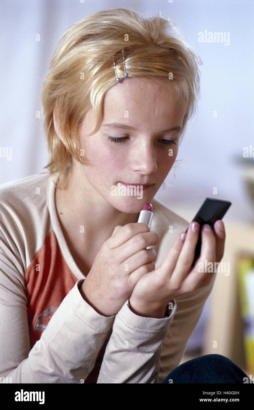 Girl, concentrates, pouch reflectors, lipstick, apply, model released, at home, teenager, young persons, leisure time, concentration, Beauty, beauty, cosmetics, cosmetics article, greasepaint, make-up article, make up, vanity case, hand reflector, cosmeti Stock Photo