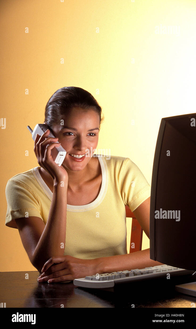 Woman, computer, call up, work, happy, 20-30 years, 25 years, office workers, work, learn data processing, phone cordless, communication, telecommunication, Internet, online, leisure time, chat, entertainment, consumer electronics, telephone call, phone c Stock Photo