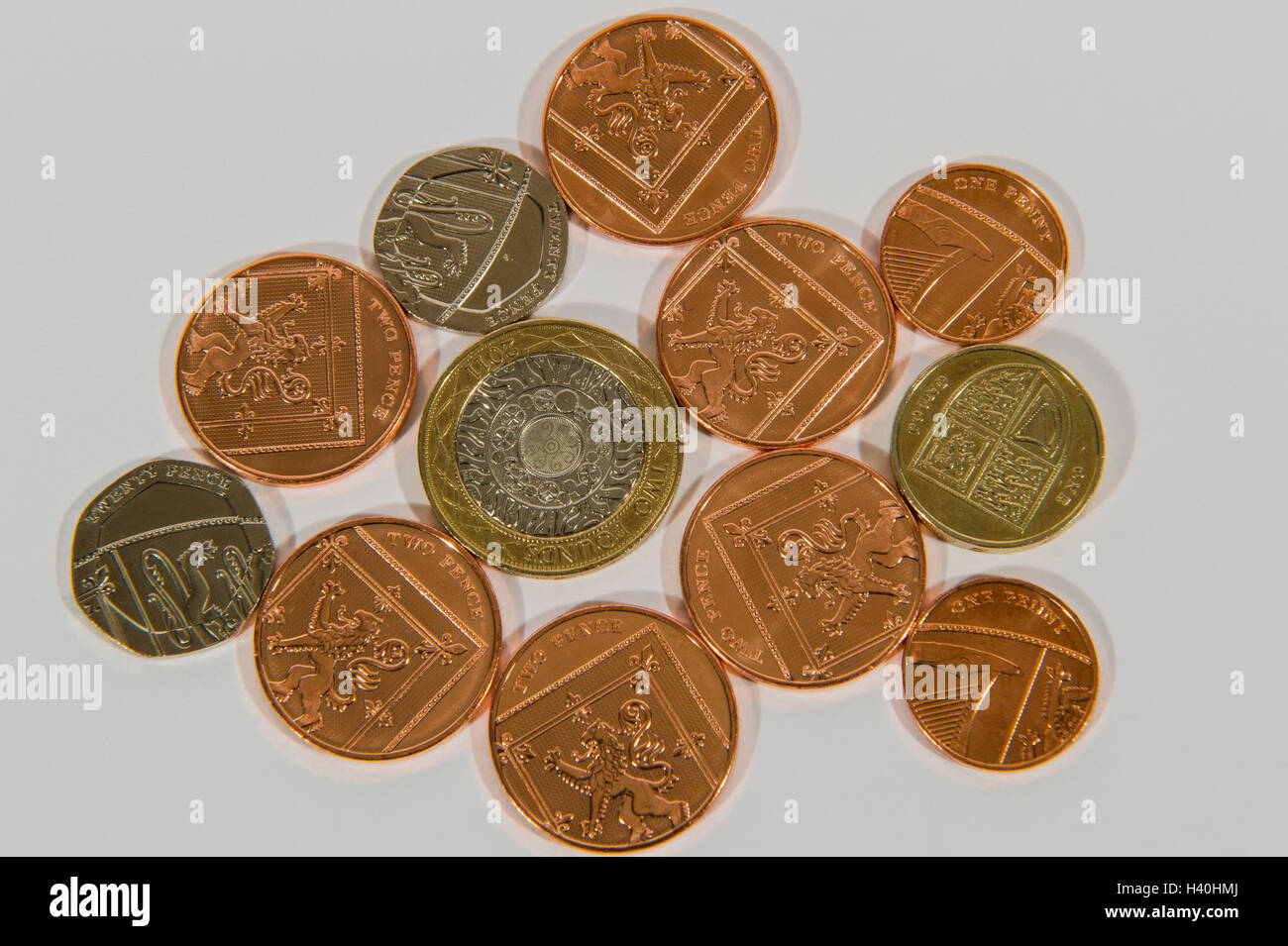 Close-up detail of money - current UK sterling coins in various denominations, both copper and silver - £2, £1, 20p, 2p,1p. Stock Photo