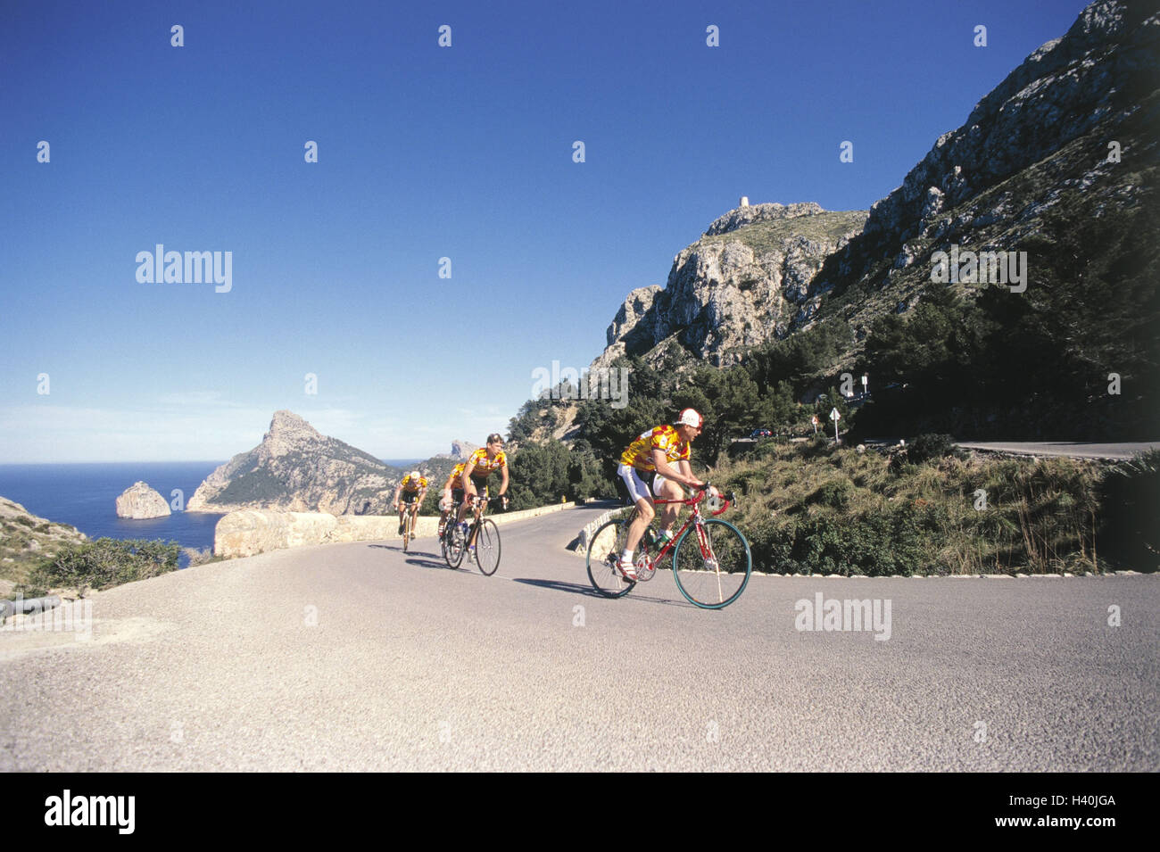 Spain, Majorca, form goal, mountain road, racing cyclist, uphill drive, strain, no model release the Mediterranean Sea, the Balearic Islands, island, country road, sportsman, cyclist, team, racing wheels, riding of a bike, Rennradfahren, cycling tour, bic Stock Photo