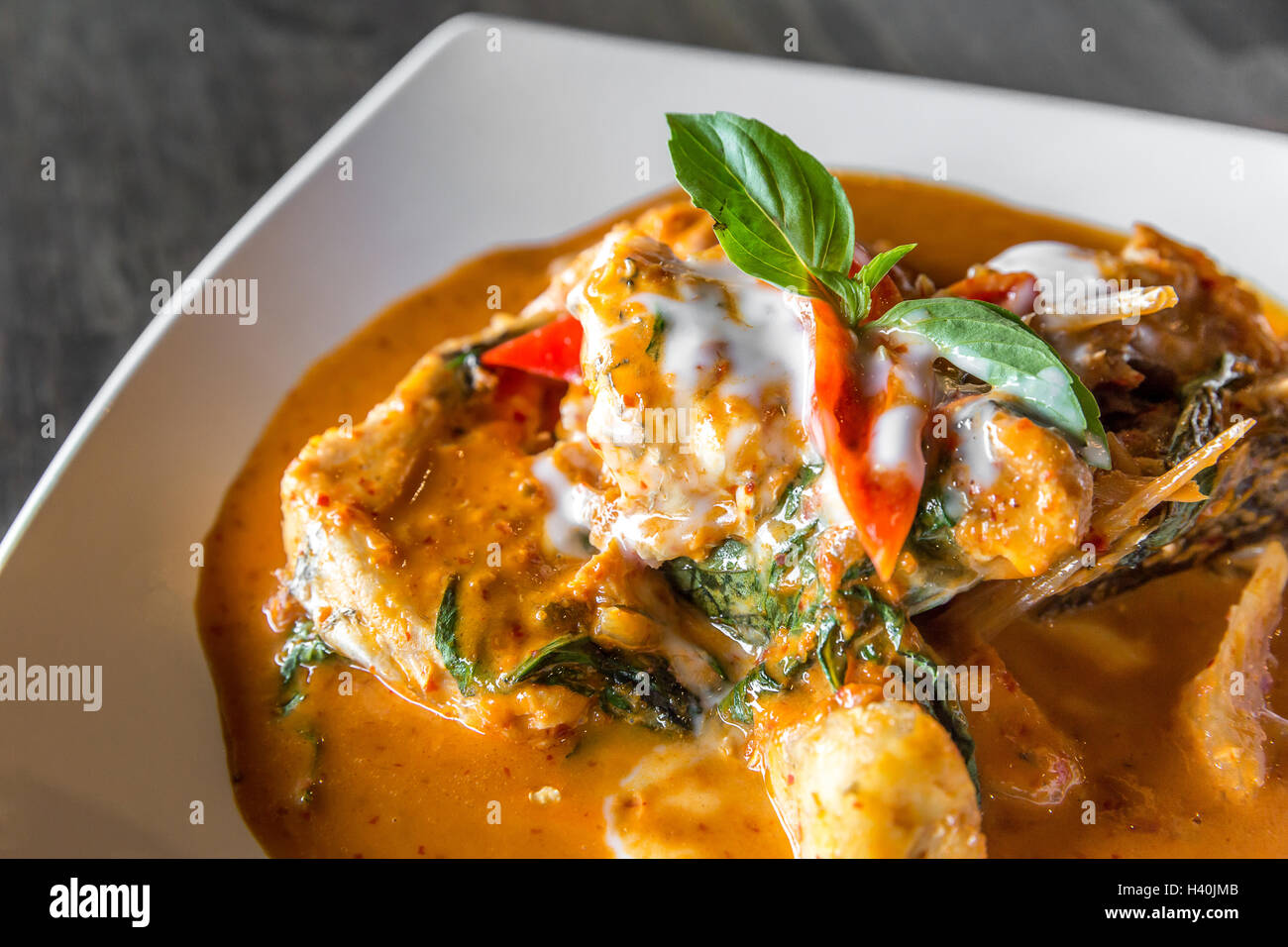 Fried grouper Fish with Red Curry Paste Chu Chee Pla Stock Photo Alamy