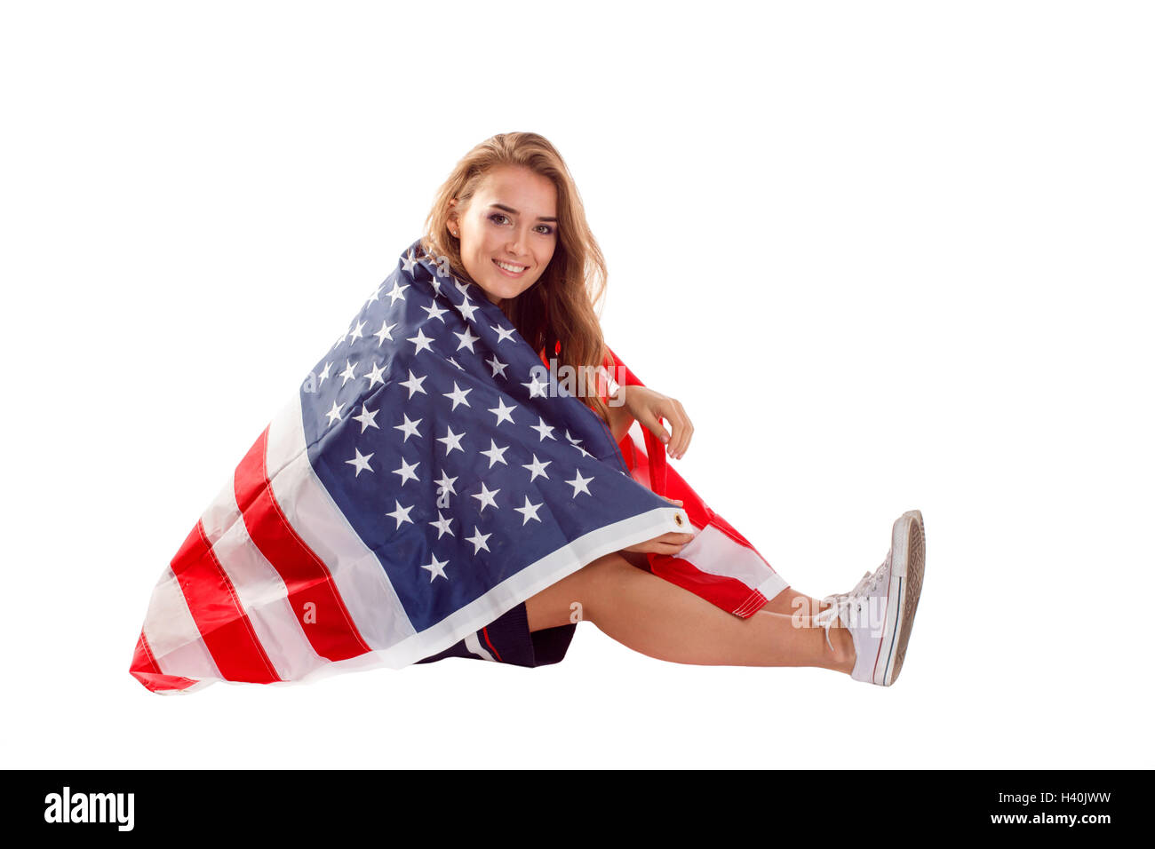 Happy young woman holding USA flag. Image isolated on a white ...