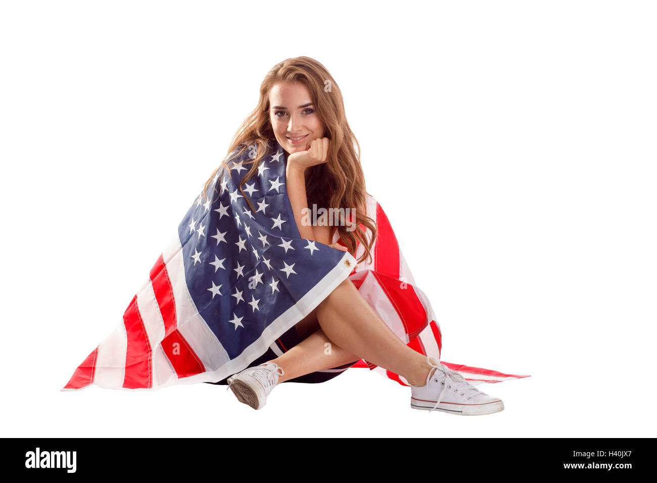 Happy young woman holding USA flag. Image isolated on a white ...
