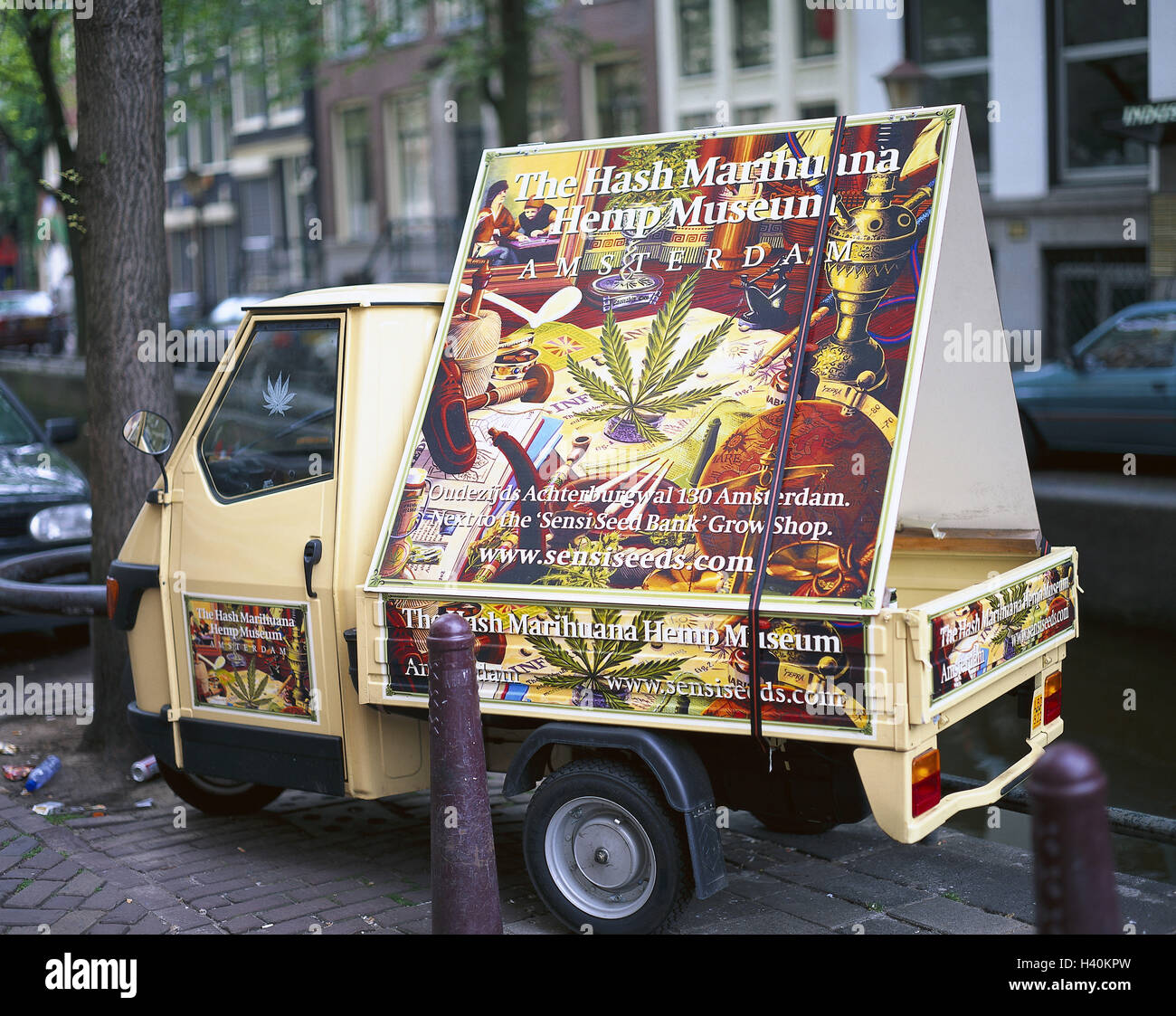 The Netherlands, Amsterdam, lane, vehicle, advertising sign 'Hash, marihuana Hemp museum', Europe, Benelux, Holland, capital, roadside, tricycle, Piaggio, advertising vehicle, advertisement, advertisement, advertising label, drugs, drugs, legality, place Stock Photo