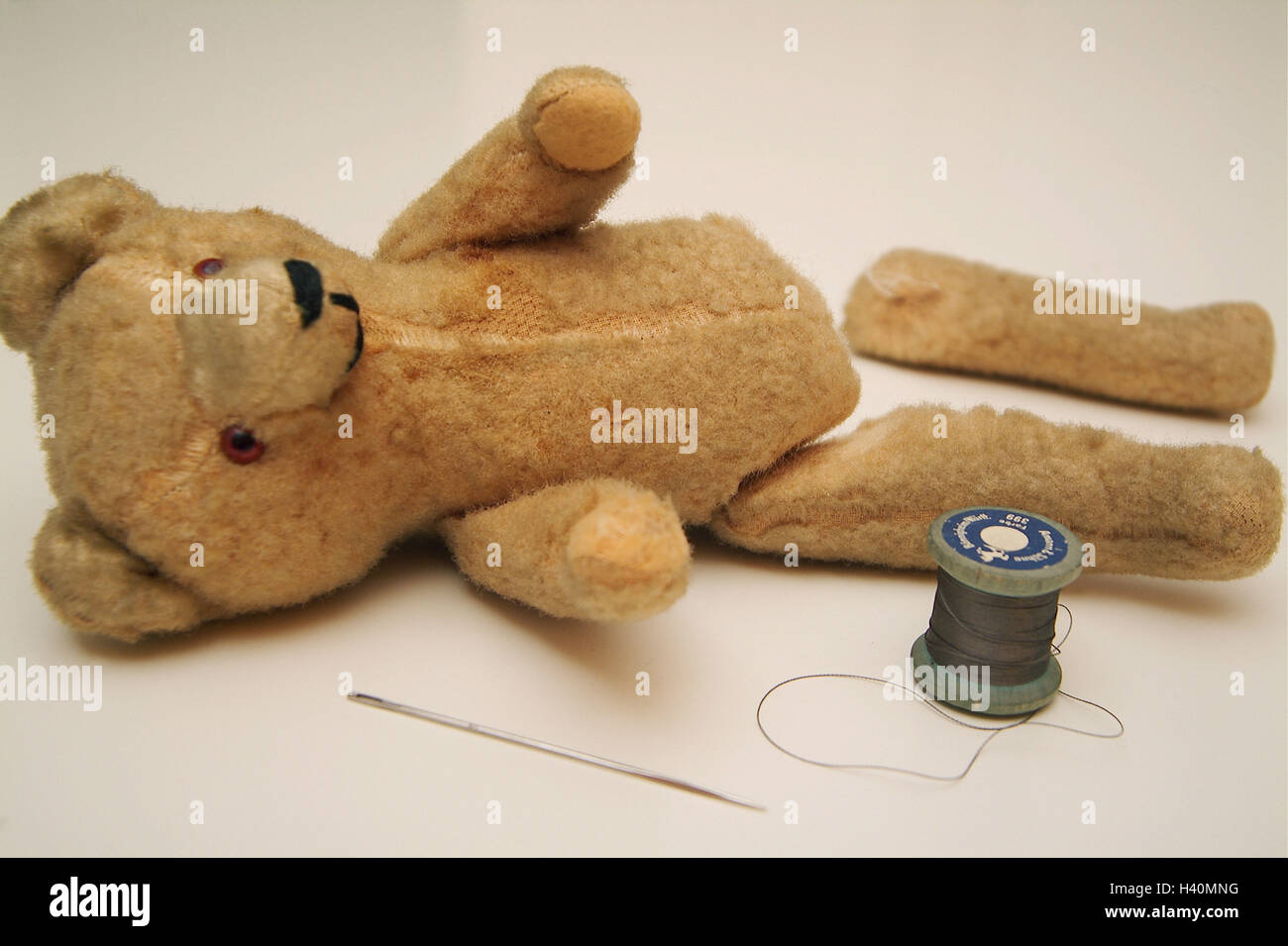 Soft toy, teddy bear, broken, bone, ragged, needle, thread, toys, soft animal, nonsense animal, soft toy, Teddy, Stoffteddy bear, nostalgically, old, uses, worn-out, discarded, forget, lie, foot loose, torn out, damage, defective, defectively, broken, rui Stock Photo