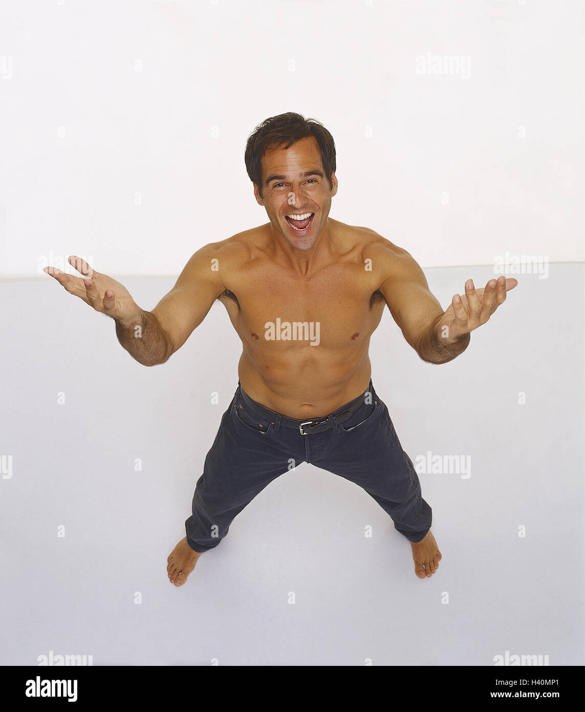 Man, young, free upper part of the Body, gesture, Men laugh, barefoot, happy, funnily, melted, joy life, fun, enthusiasm, body language, studio, cut out, from above, Stock Photo