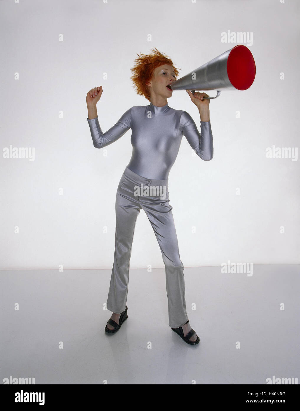 Woman, young, hairs, red, clothes, silver, megaphone, 'shout', gesture, Future, futuristic, studio, hair, hairstyle, briefly, stand off, exclaim megaphone, megaphone, sound funnel, megaphone, announce, announce, shout, communication, information, news, cy Stock Photo