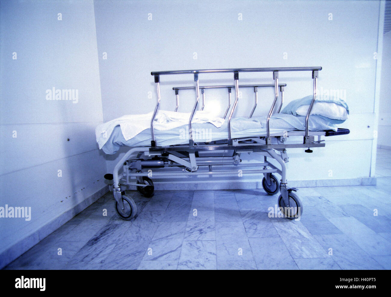 Hospital, hall, transport couch, blank, clinic, walk, transport bed, rolling bed, patient's bed, sickbed, cot, put down, marble floor, stone floor, destiny, hopelessness, disease, medicine, colour mood, colour blue, Ti7 Stock Photo