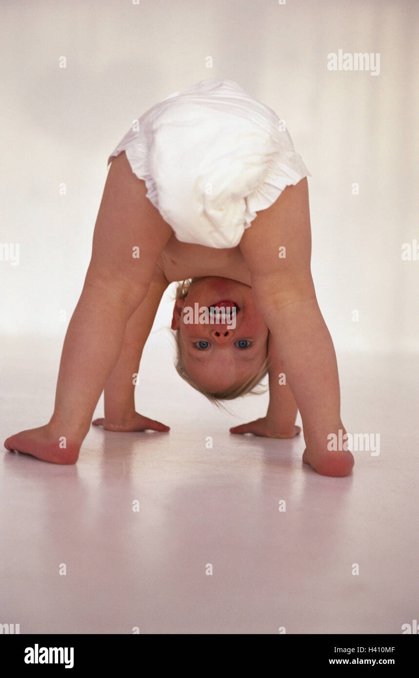 Baby, nappy, quadruped's state, view, bones child, infant, 1 - 2 years, development, development phase, fun, game, play, do gymnastics, motion, mobility, laugh, joy Stock Photo