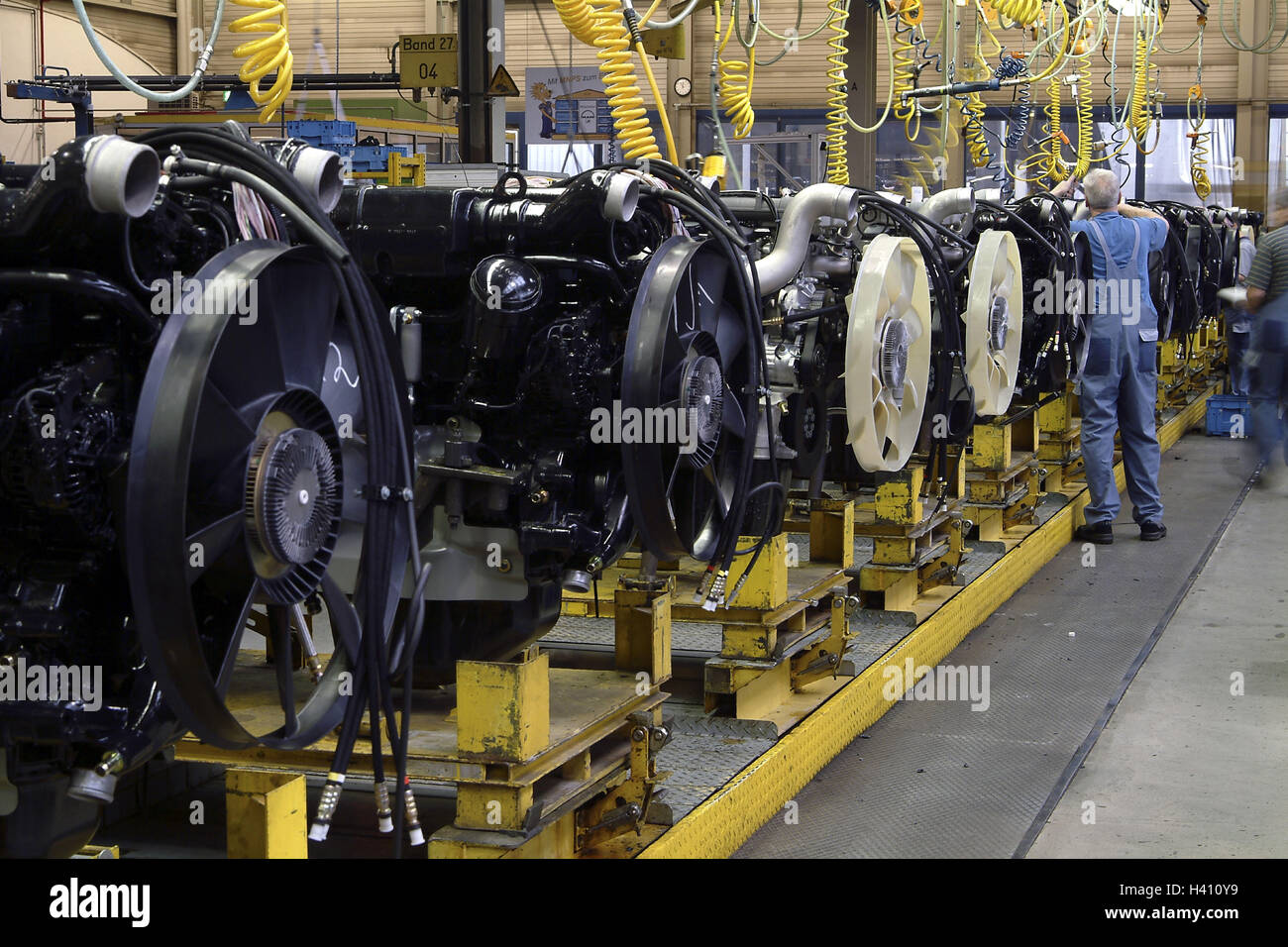 One truck production, factory building, engine warehouse, worker, back view, Europe, Bavaria