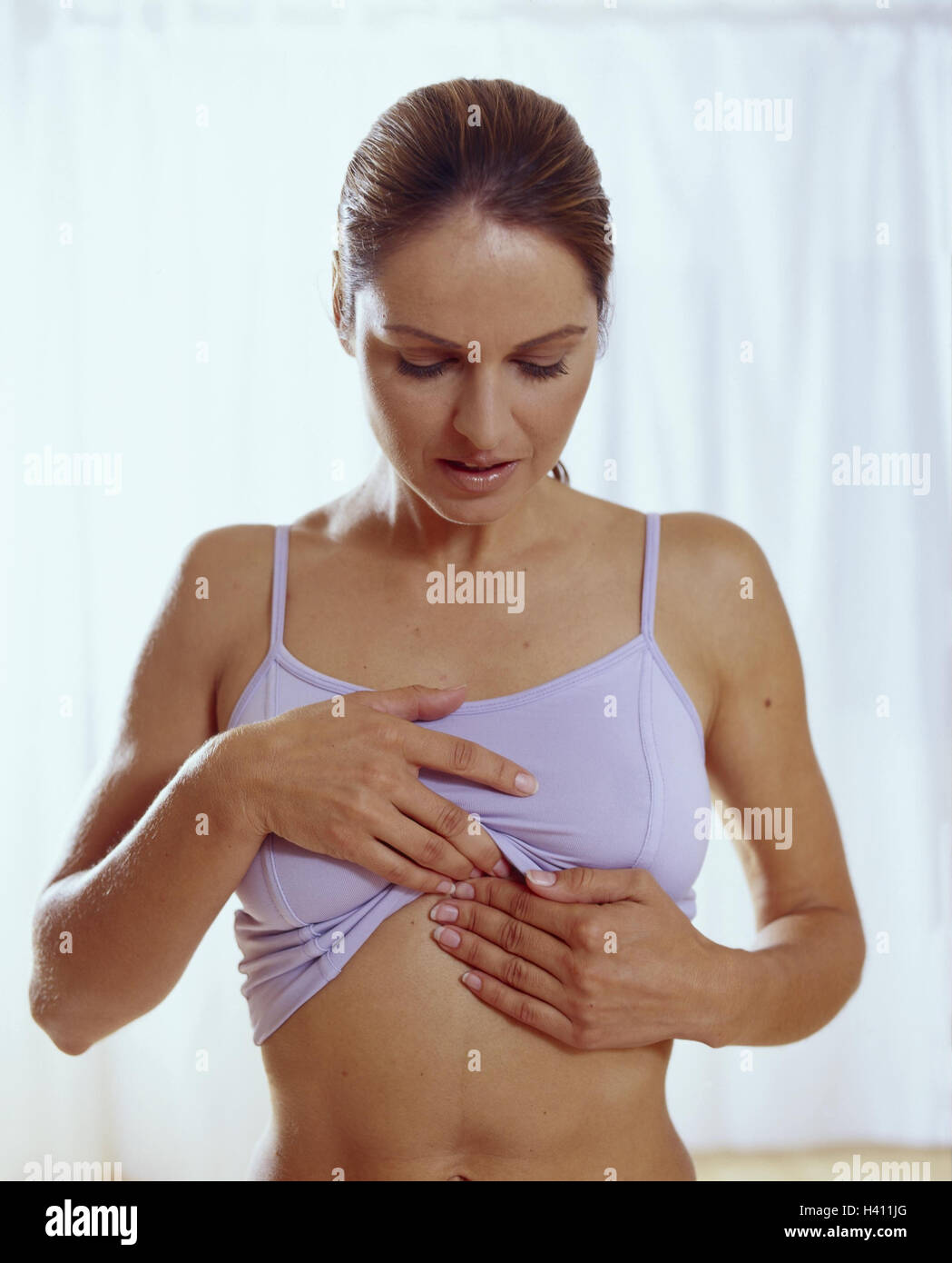 Woman, young, acupressure, breastbone, half portrait, autoacupressure, cure, medicine, alternatively, TCM, traditional Chinese medicine, therapy, selftreatment, sternum Stock Photo