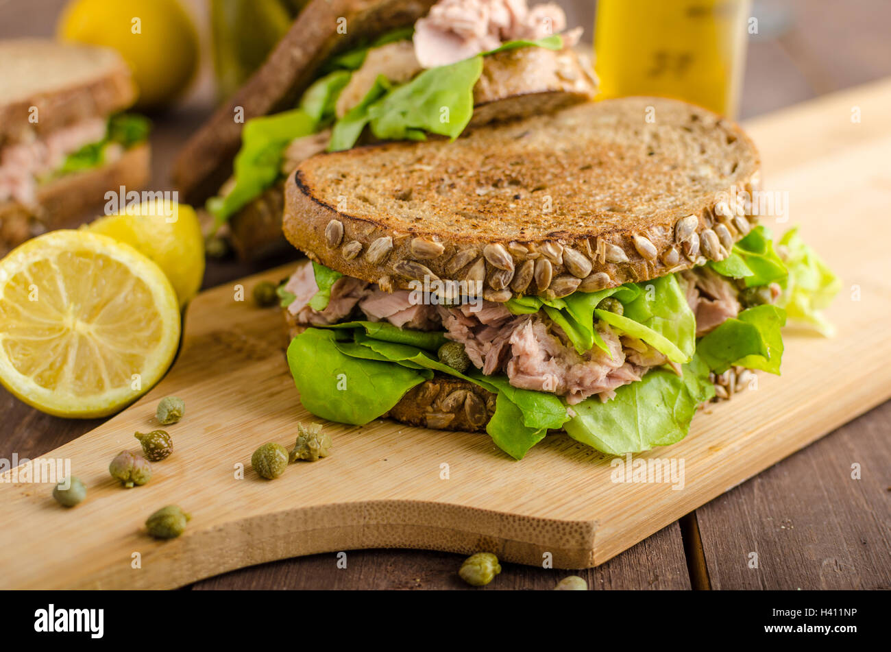 Tuna sandwich, capers, seed bread, lemon juice for freshness, little
