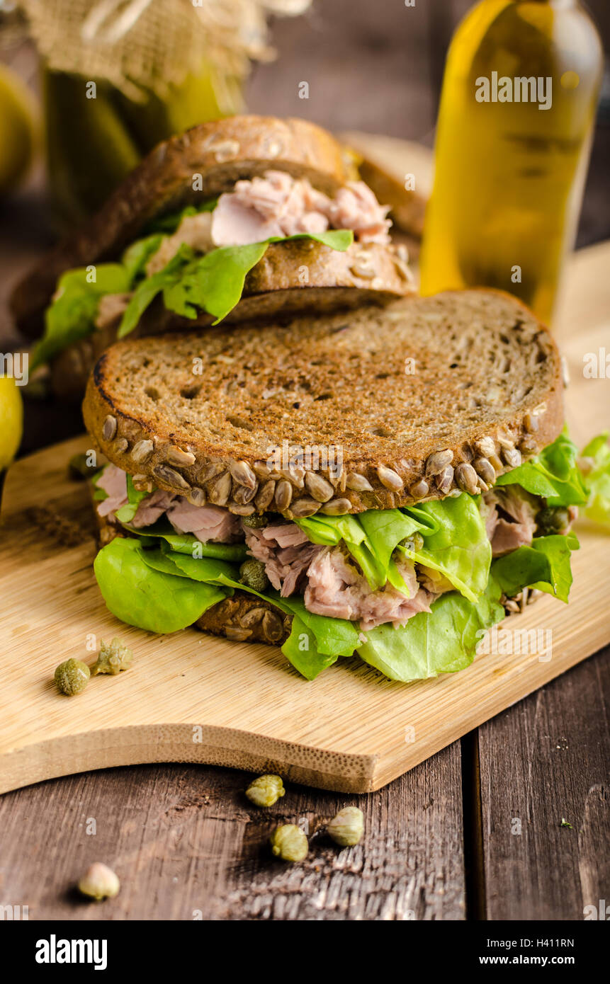 Tuna sandwich, capers, seed bread, lemon juice for freshness, little