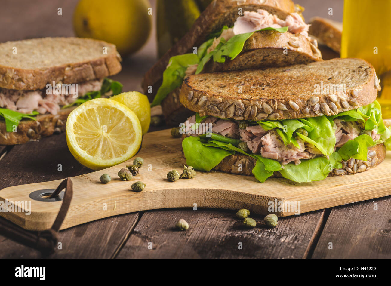Tuna sandwich, capers, seed bread, lemon juice for freshness, little
