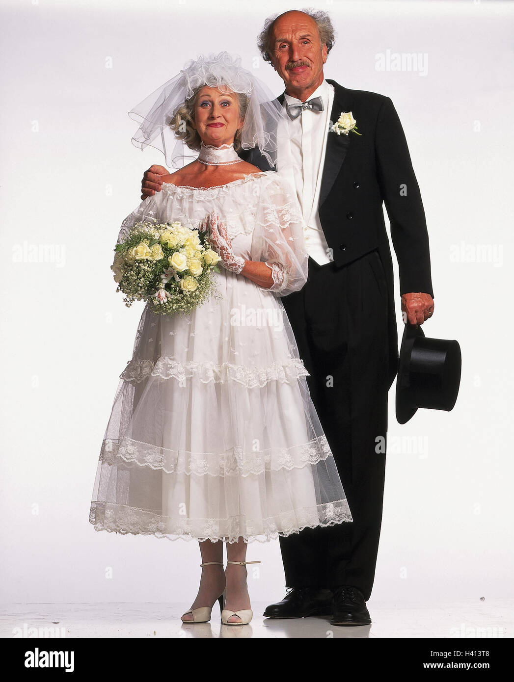 Bride and groom, senior citizens, stand ...