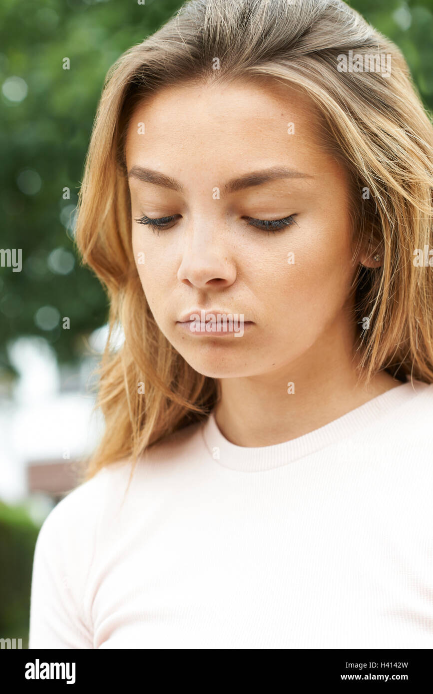 Head And Shoulders Portrait Of Serious Teenage Girl Stock Photo Alamy