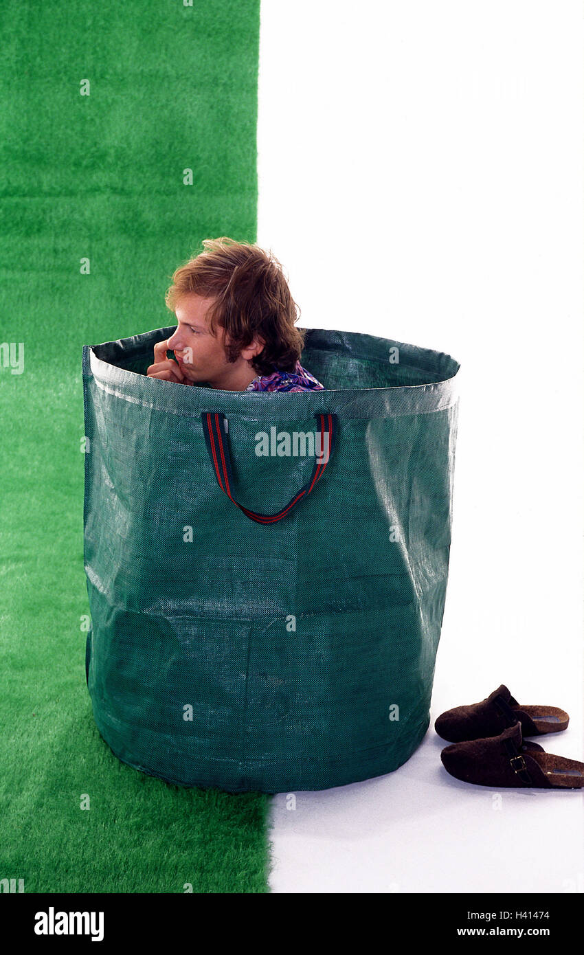 Man sit young foliage pouch nasal drilling tread art turf 20 30 years pouch case green hide ready to be launched boredom boringly bored unemployed gardening hobby amateur gardener plastic turf slipper...