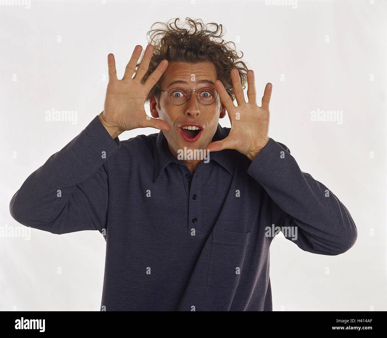 Man, young, glasses, gesture, feel, joy, enthusiasm, half portrait, Men, hairs, wavy, curls, blond, studio, cut out, astonished, surprises, surprise, astonishment, see, discover, discovery, pantomime, Stock Photo