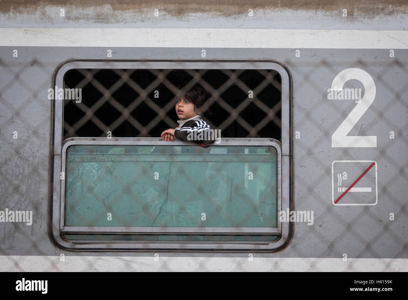 A refugee child on the train in Dobova train Station, just across Croatian-Slovenian border. Stock Photo