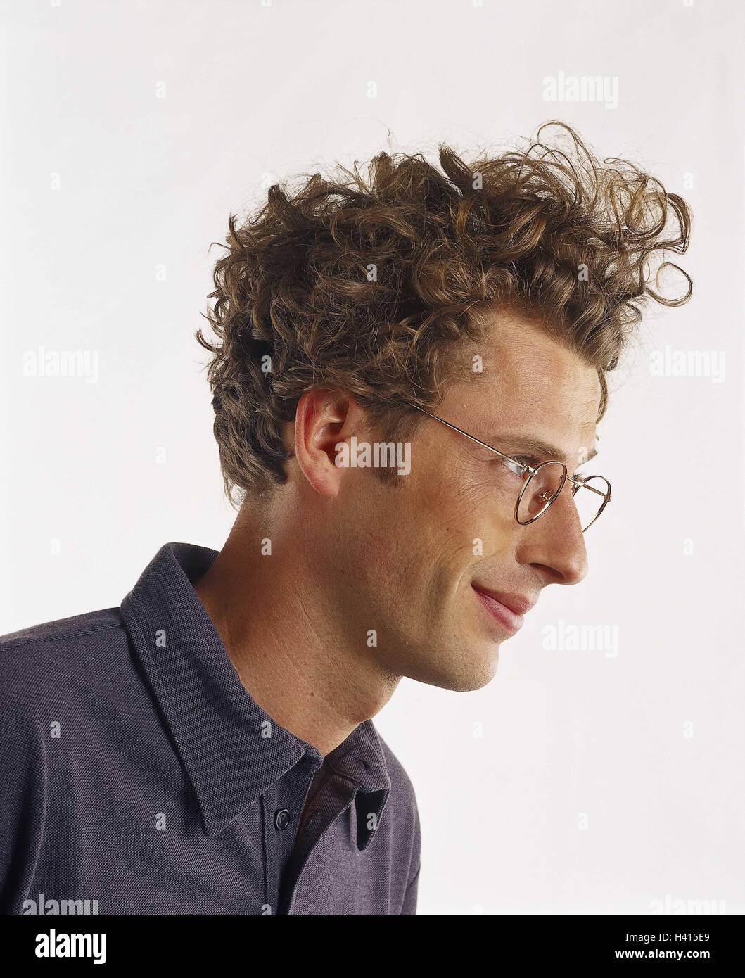 Man, young, glasses, curls, smile, portrait, side view, Men, hairs, wavy,  blond, smile, happy, studio, cut out, tread Stock Photo - Alamy