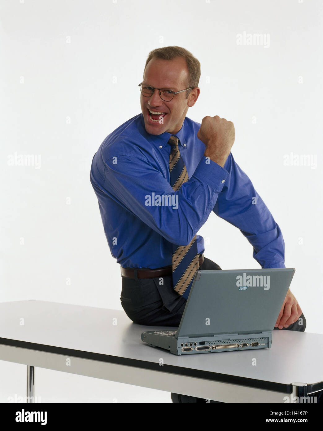 Businessman, young, laptop, gesture, success, table, sit, professions, studio, cut out, notebook computer, successfully, enthusiasm, enthusiastically, man, joy, Stock Photo