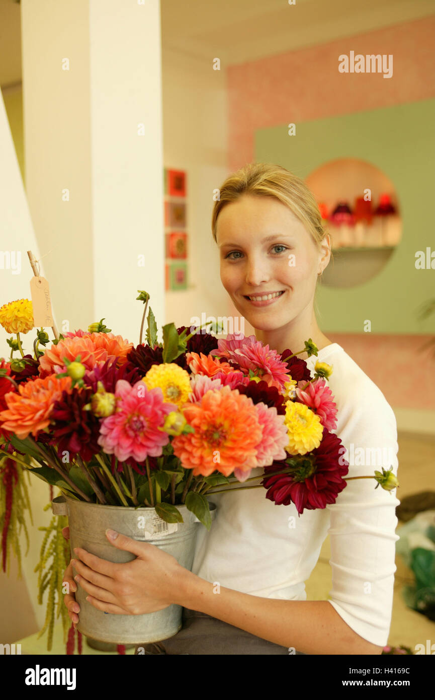 Flower business, florist, bucket, dahlias, half portrait, flower shop