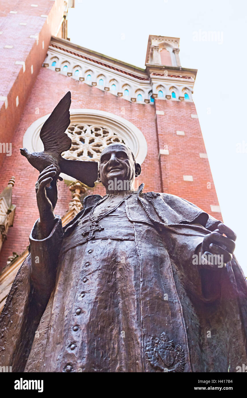 The statue of Pope John XXIII, also known as the Turkish Pope, in the courtyard of St Antony's church, Istanbul, Turkey. Stock Photo