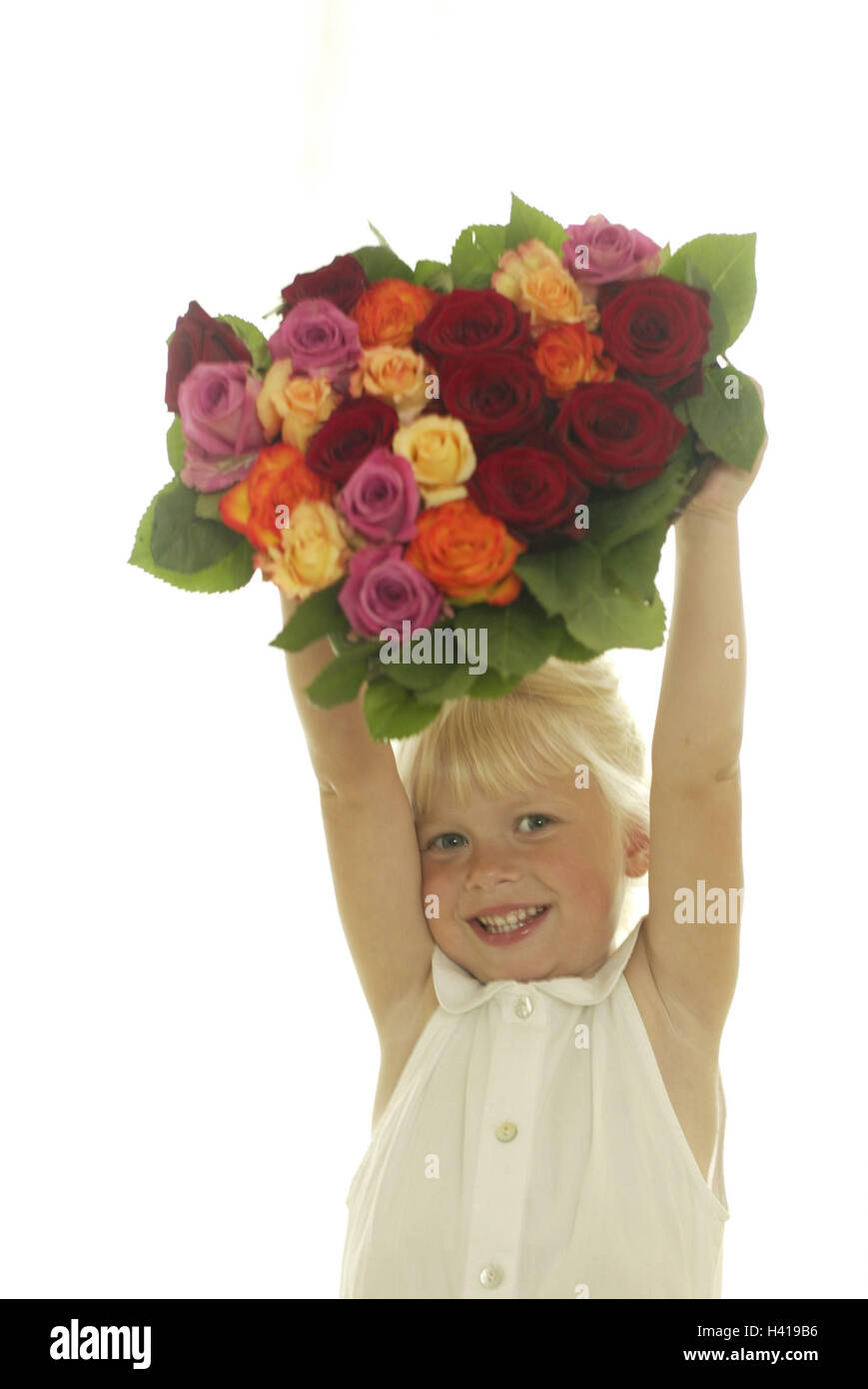 Girls, cheerfully, rose bouquet,  holds up, portrait  Series, child portrait, child, 5 - 10 years, blond, smiles, gives happily, joy, gives, mother day, Valentine's day, birthday, bouquet, heart-shaped, flower bouquet, roses, blooms, colors, differently, indoors, studio, free plates Stock Photo