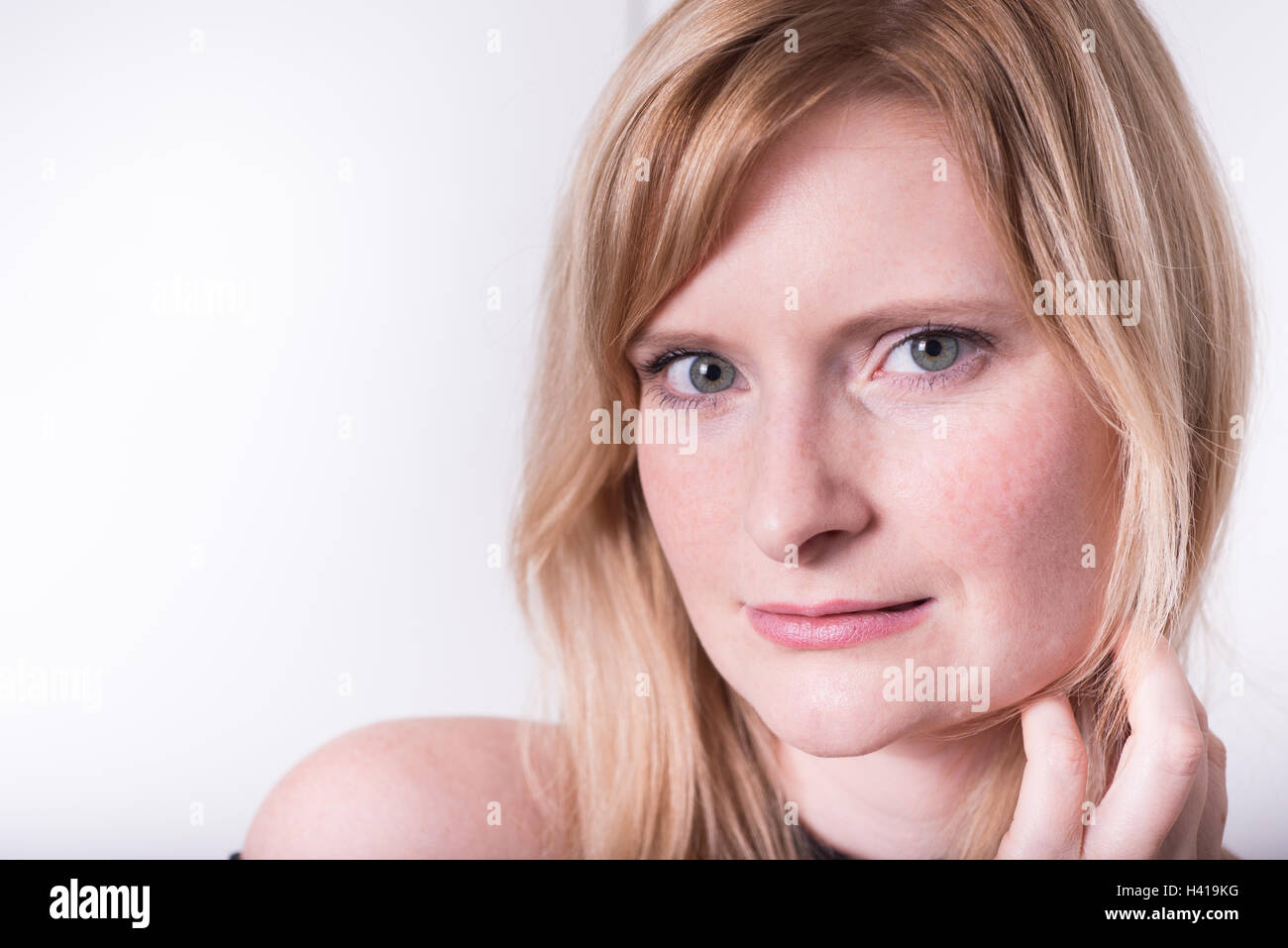Blonde woman looking at camera hi-res stock photography and images - Alamy