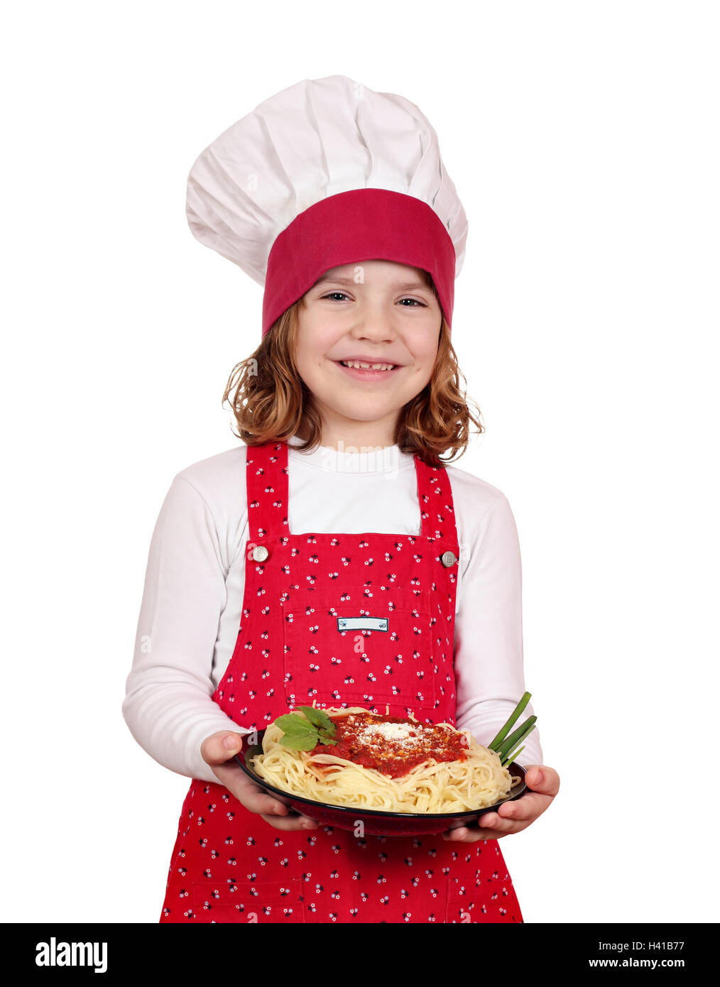 happy little girl cook with spaghetti on white Stock Photo