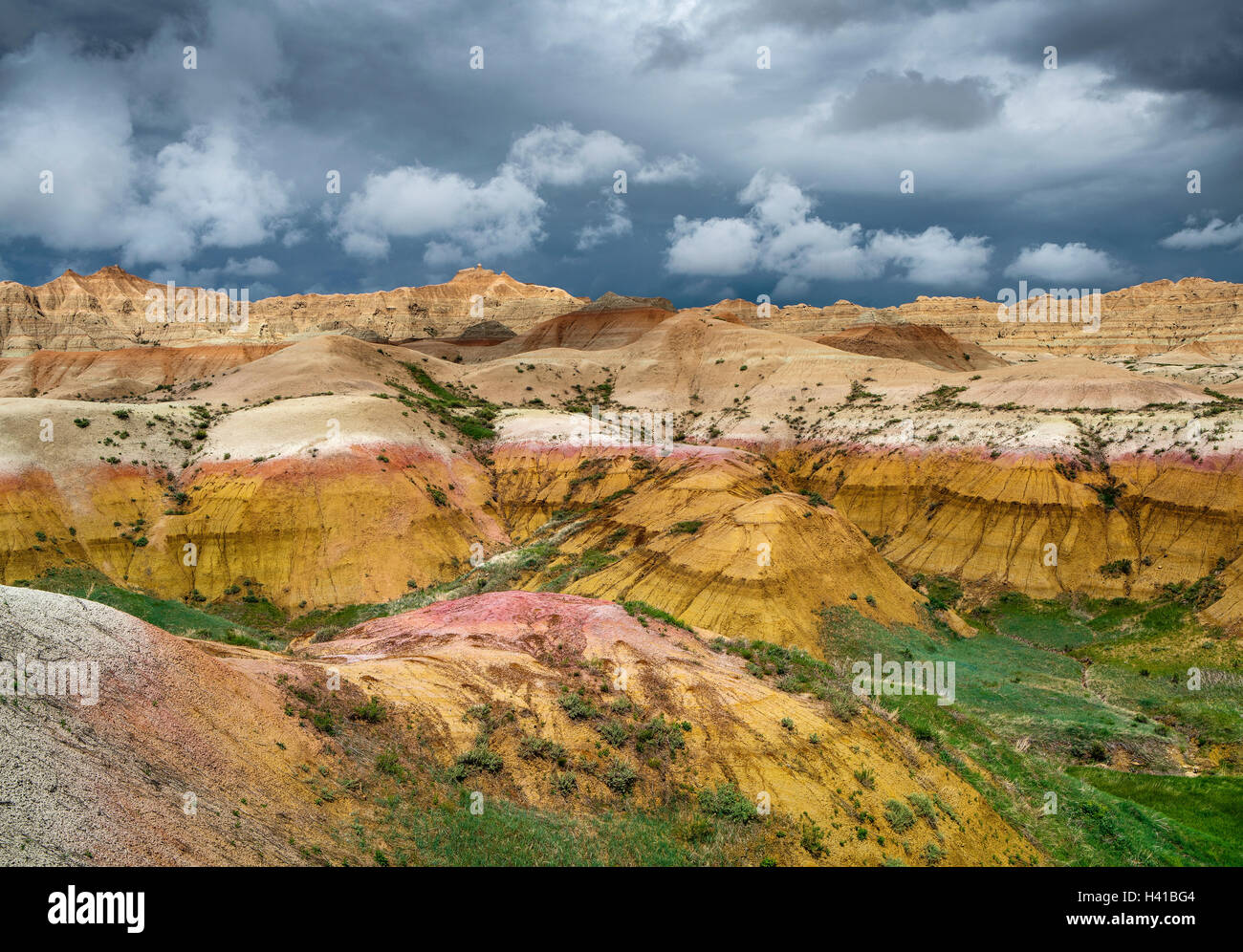 Badlands National Park, South Dakota:   Clearing storm clouds over the eroded Yellow Mounds landforms near Dillon pass Stock Photo