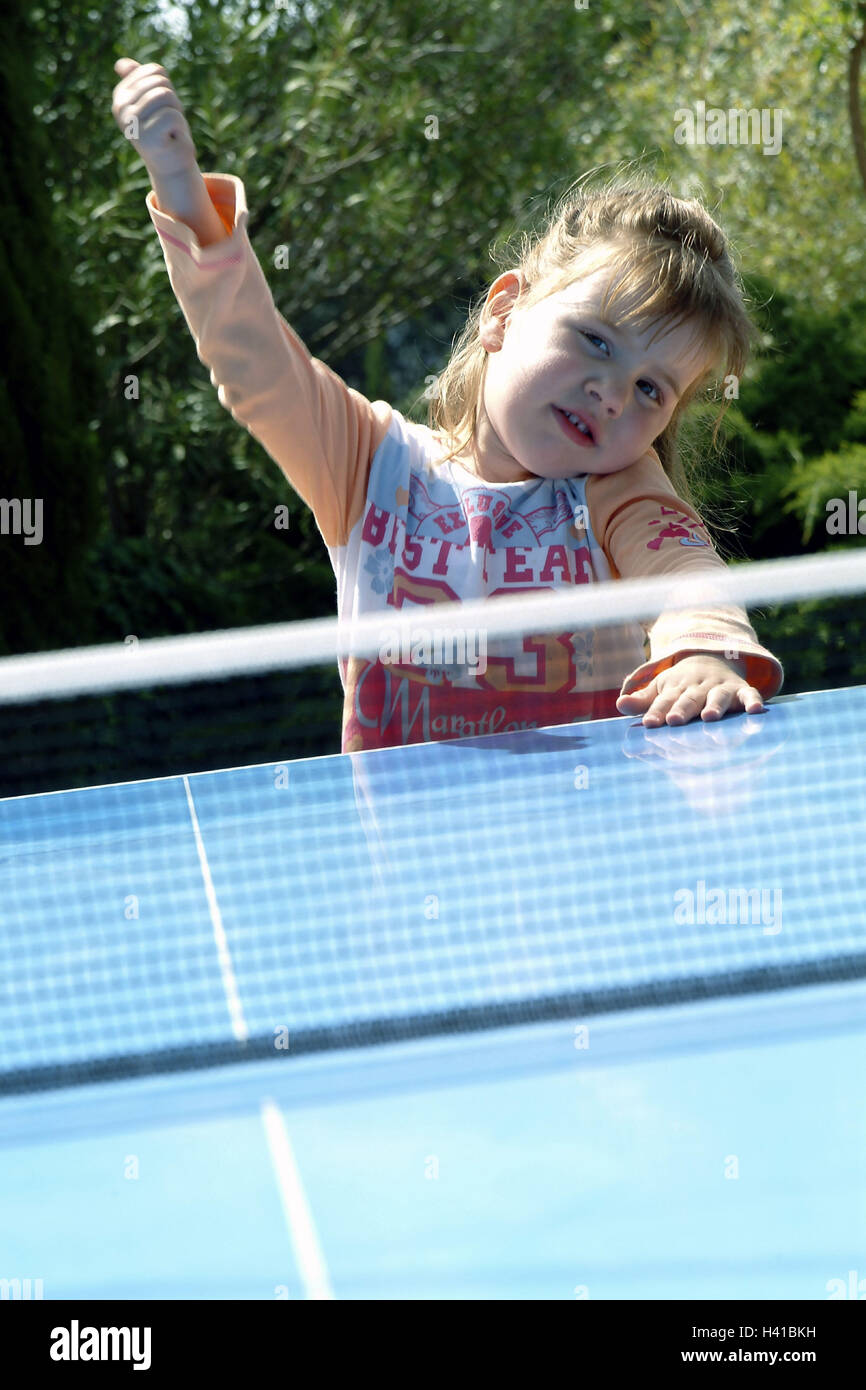 Table tennis disk, detail, network, girl, gesture, portrait, child portrait, child, 4 years, infant, pollex high, view camera, sport, sport, table tennis, leisure time, hobby, game, ball game, setback game, summer, outside Stock Photo