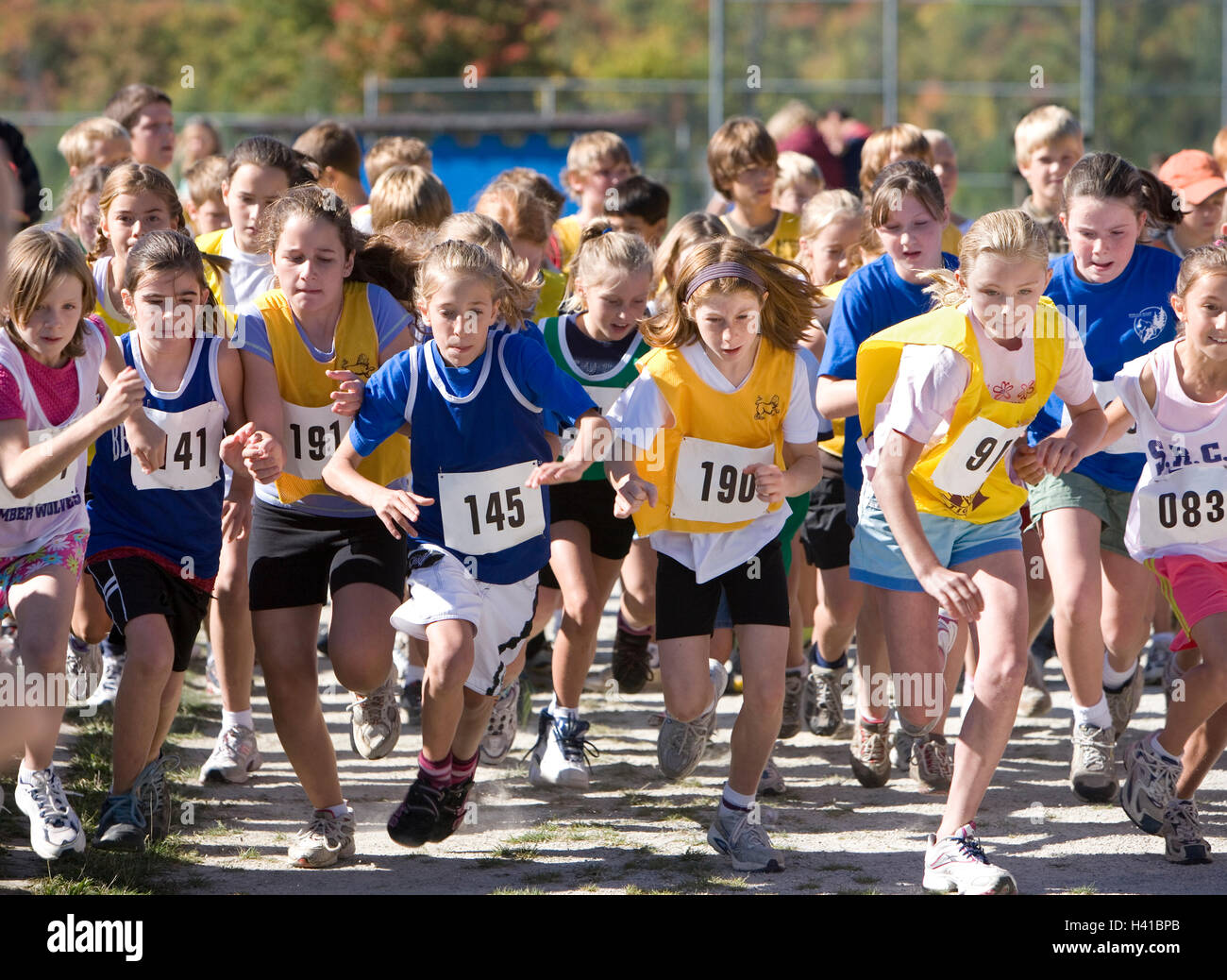 girls running in track meet Stock Photo