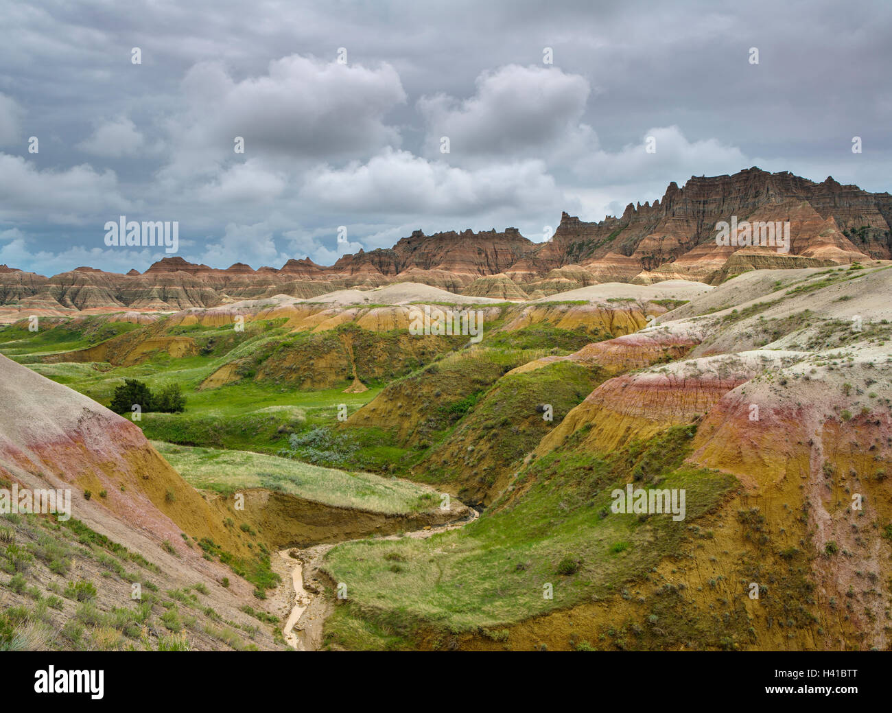 Badlands National Park, South Dakota:   Clearing storm clouds over the eroded Yellow Mounds landforms near Dillon pass Stock Photo