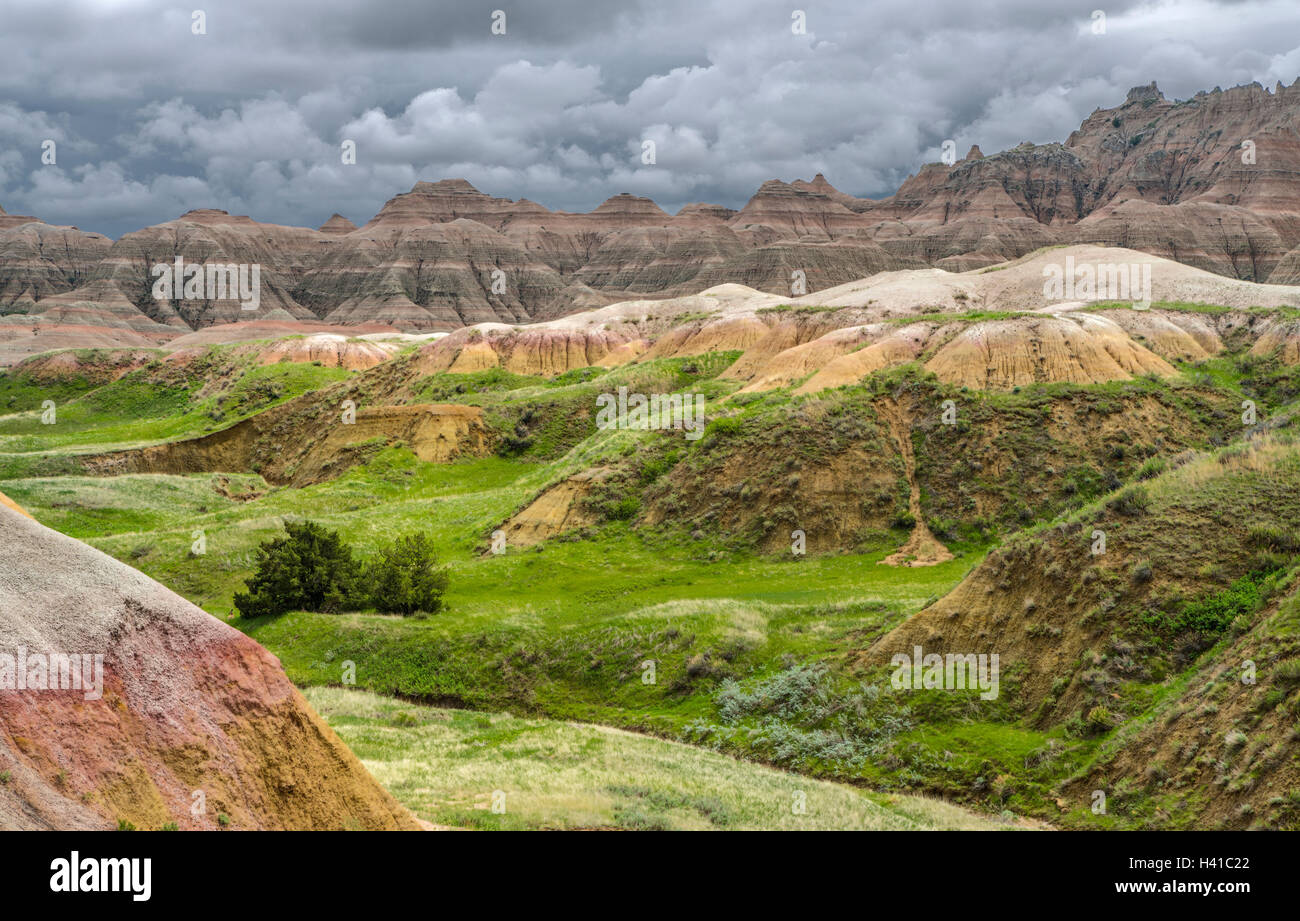 Badlands National Park, South Dakota:   Clearing storm clouds over the eroded Yellow Mounds landforms near Dillon pass Stock Photo