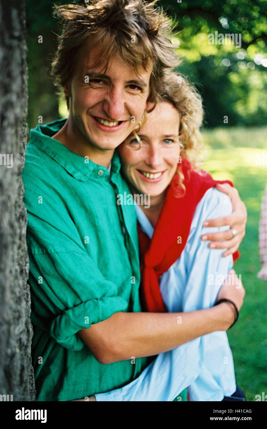 Couple, young, falls in love, happy, embrace, trunk, lean, partnership, friendship, love, harmony, affection, feeling, luck, happy, smile, summer, outside, half portrait Stock Photo