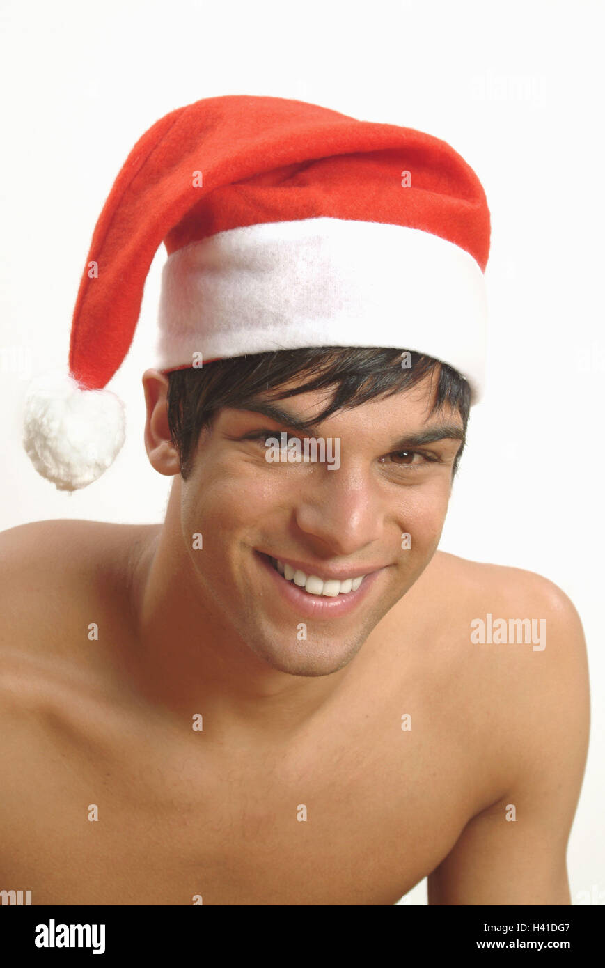 Man, young, smile, free upper part of the body, Santa's hat, portrait, man's portrait, 20-30 years, dark-haired, happy, cheerfulness, person, Christmas, Christmas, yule tide, for Christmas, Christmas, xmas, x-mas, feast, feasts, holidays, funnily, positiv Stock Photo