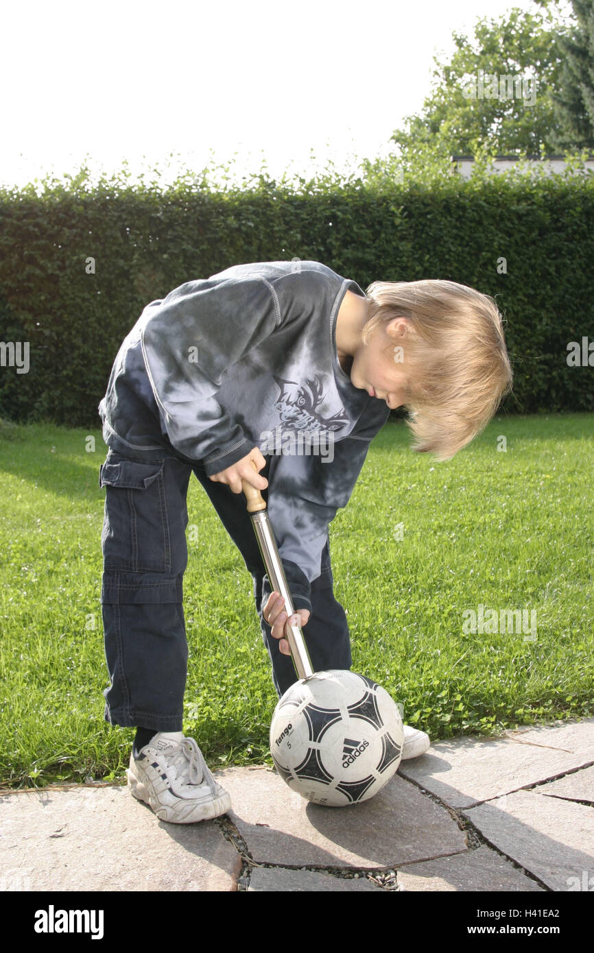 Terrace, boy, football, air pump, inflate 10 years, child, blond, ball,  manual pump, pump, air, refill, fill up, effort, strain, independently,  holidays, leisure time, to football matches, games, ball games, hobby,  activity,