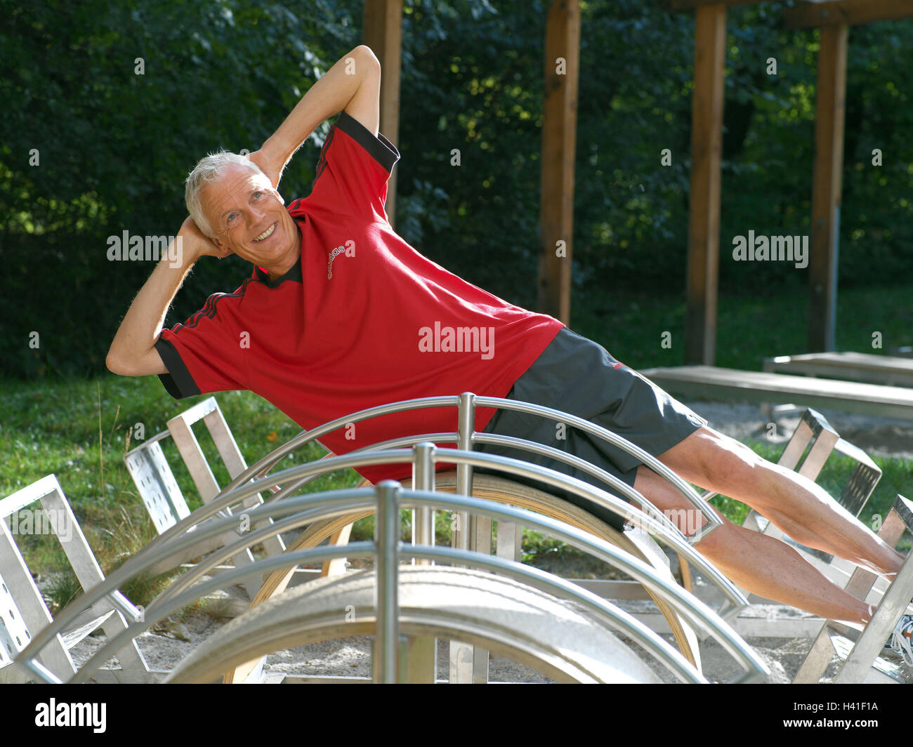 keep-fit trail, senior, training device, lie side view, practise, abdominal musculature 50-60 years, man, sportsman, sportily, sport, activity, gymnastics, gymnastics exercises, gymnastics practise, health, fitness, training, musculature, strengthening, s Stock Photo