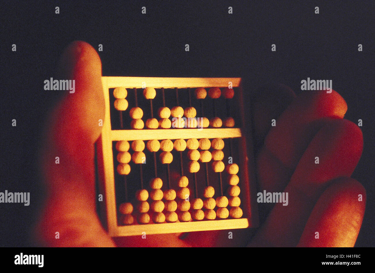 Hand, detail, miniature abacus, hold slide rule, arithmetic help ...