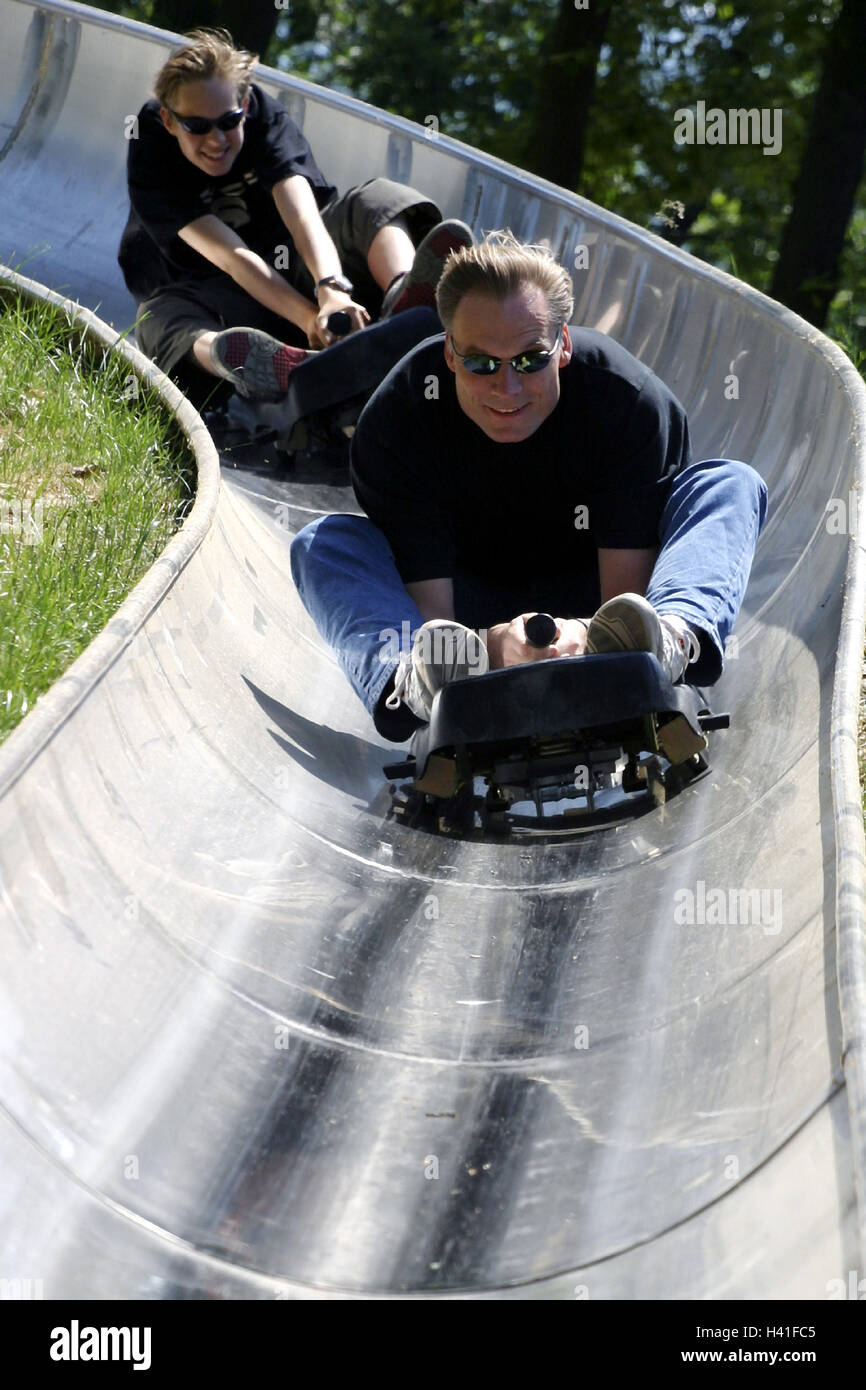 Summer toboggan run, father, son, toboggan, drive, happy, view camera