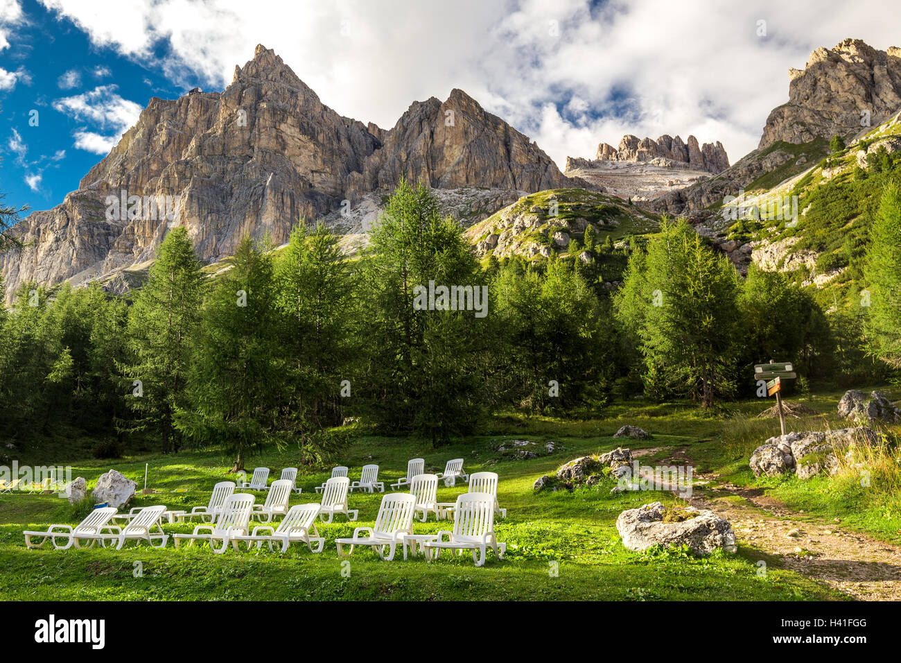 Magnificent valley with Cristallo mountain group near Cortina d'Ampezzo with relaxing chairs in foreground, Dolomites mountains, Stock Photo